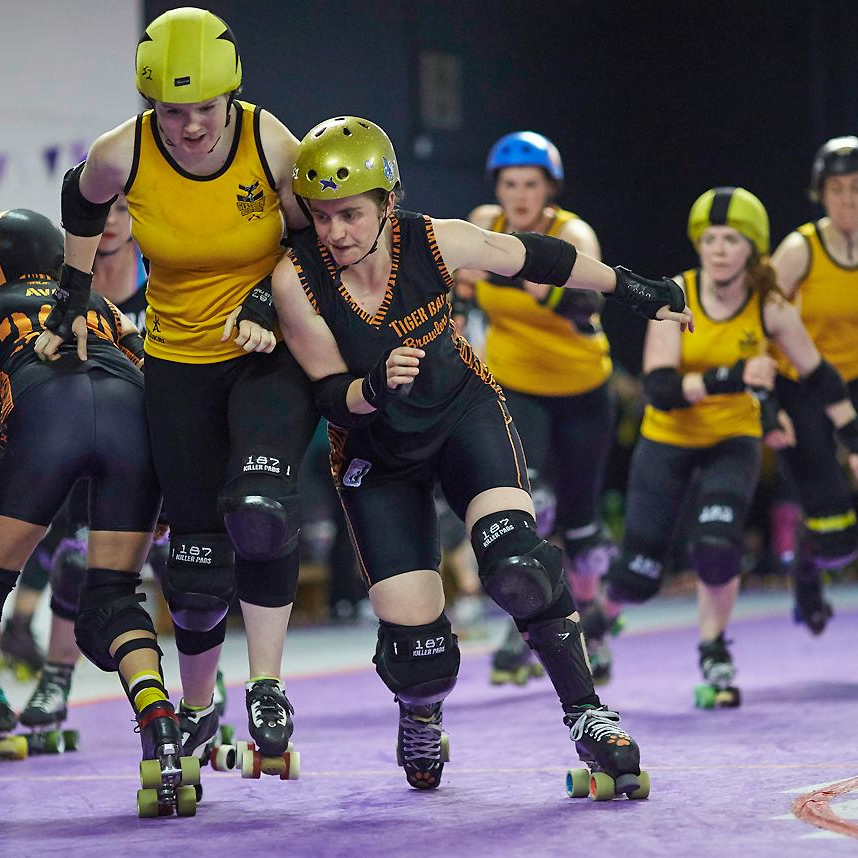 The Maidens' Nikki BlockHer Glory bursting through Tiger Bay B's defenses. Photo courtesy of Roller Derby On Film.