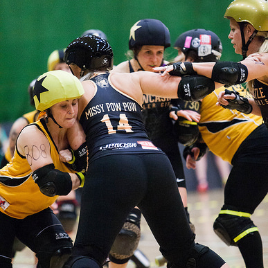 Bruise Missile fighting to get past the fierce defences of Missy Pow Pow; photo courtesy of Dave Moore .