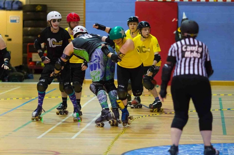 Marshall Lawless sneaks past Optimus Grime in the Co-Ed game. Photo courtesy of Ali Maddock.