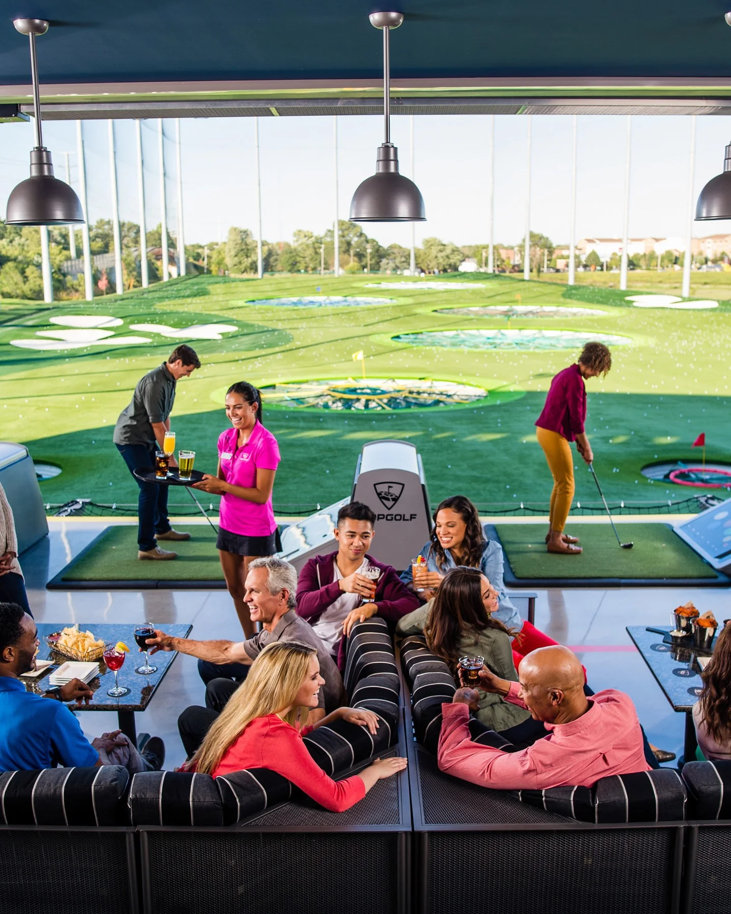 Guests playing Topgolf in Naperville IL
