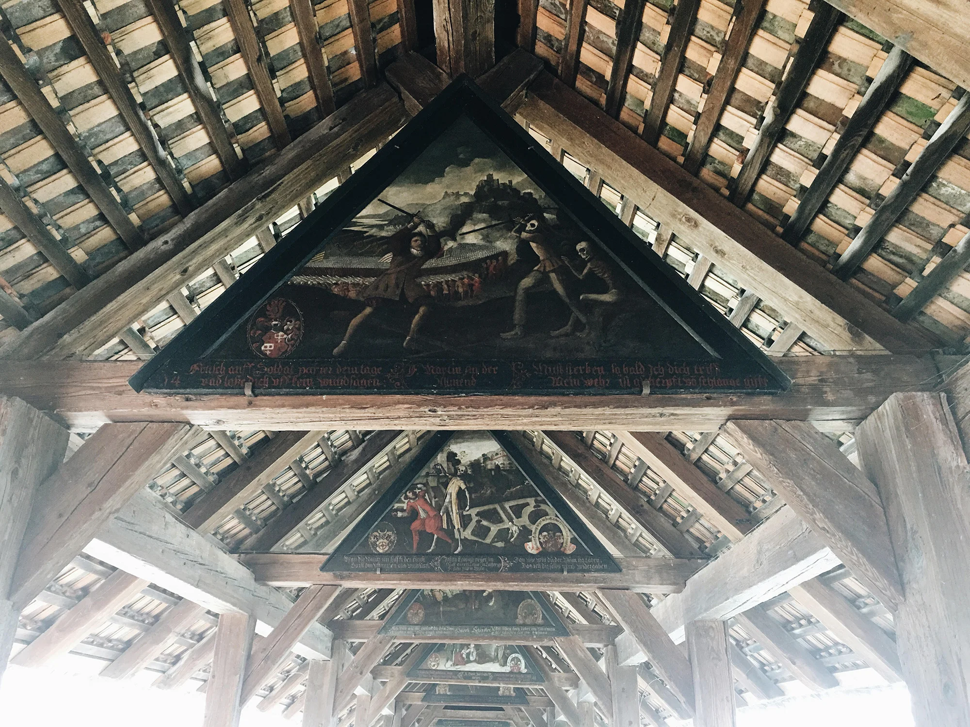 My faaaavorite gloomy cool part of Lucerne, paintings of The Dance of Death across this entire medieval bridge.&nbsp;