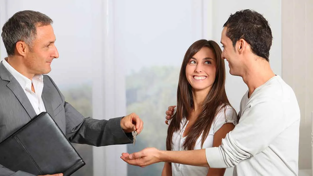 Landlord with happy tenants.jpg