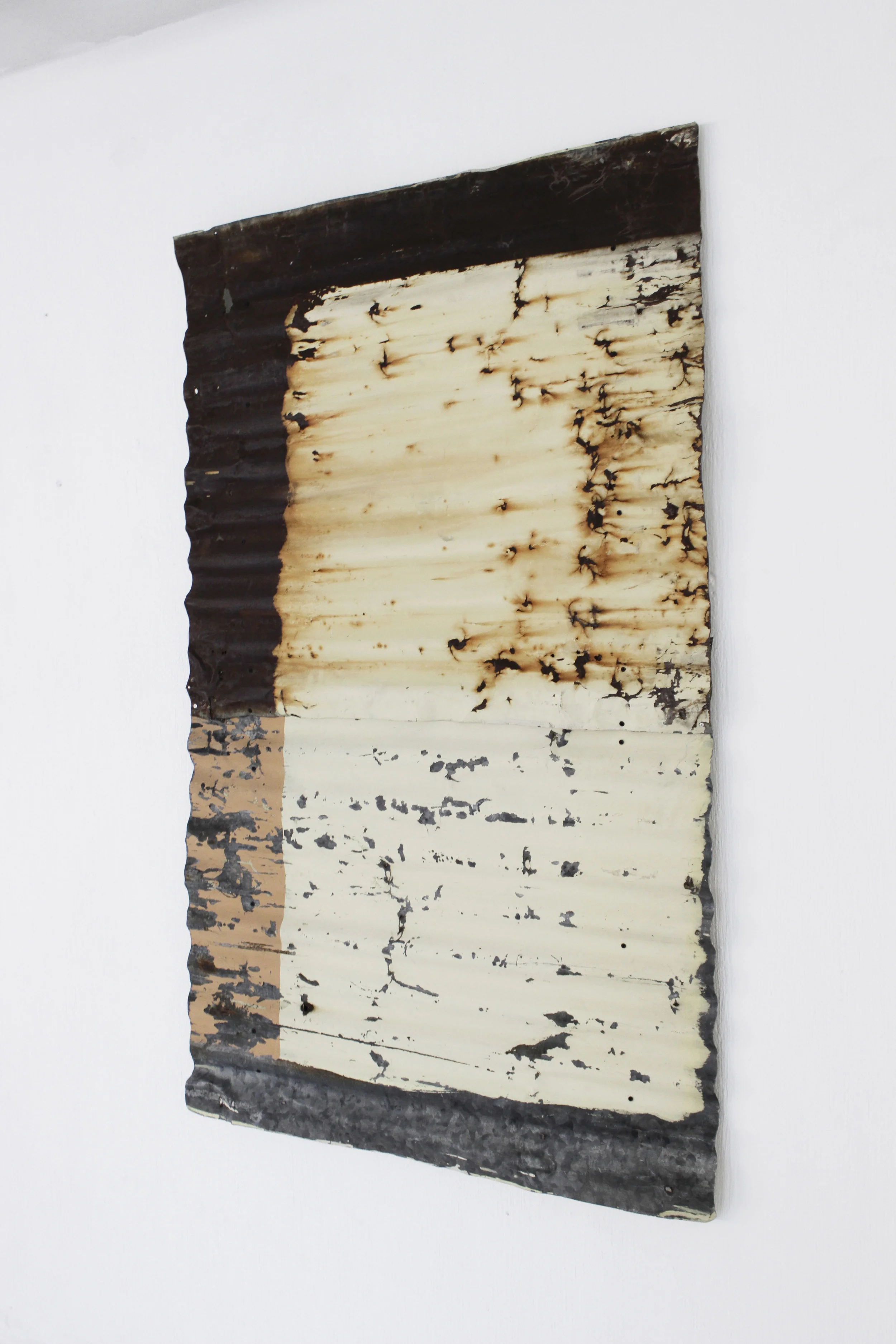 Recomposition No.4 2014 Found painted zinc sheet assembled on wood canvas, conserved with acryloid. Photo credit: Diego Sagastume