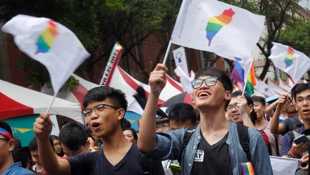 Marriage equality supporters celebrated after Taiwan's Constitutional Court ruled in favor of same-sex marriage. (Chiang Ying-ying/Associate Press)