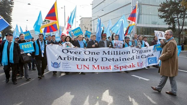 Source: AP ( Uyghur protesters outside the UN Headquarters in Geneva, Nov. 6, 2018. )