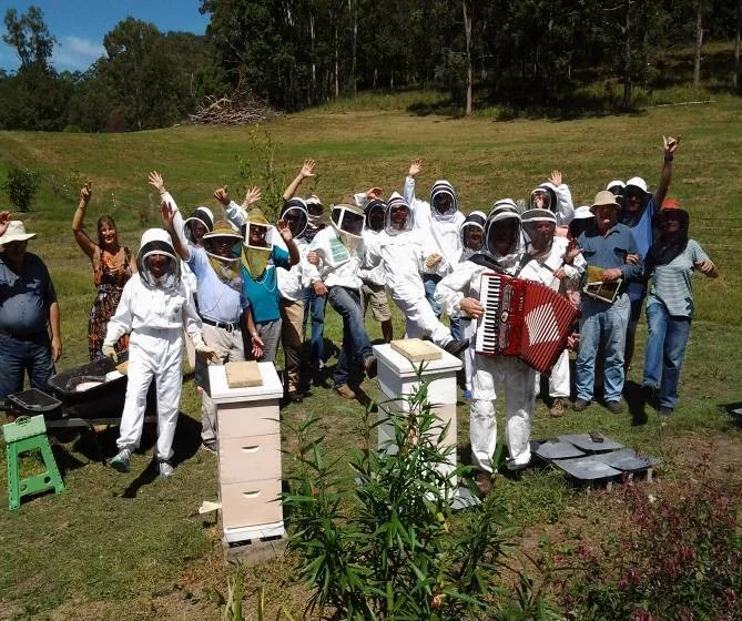 Gotta keep those bees happy – Dancing and singing in the apiary!