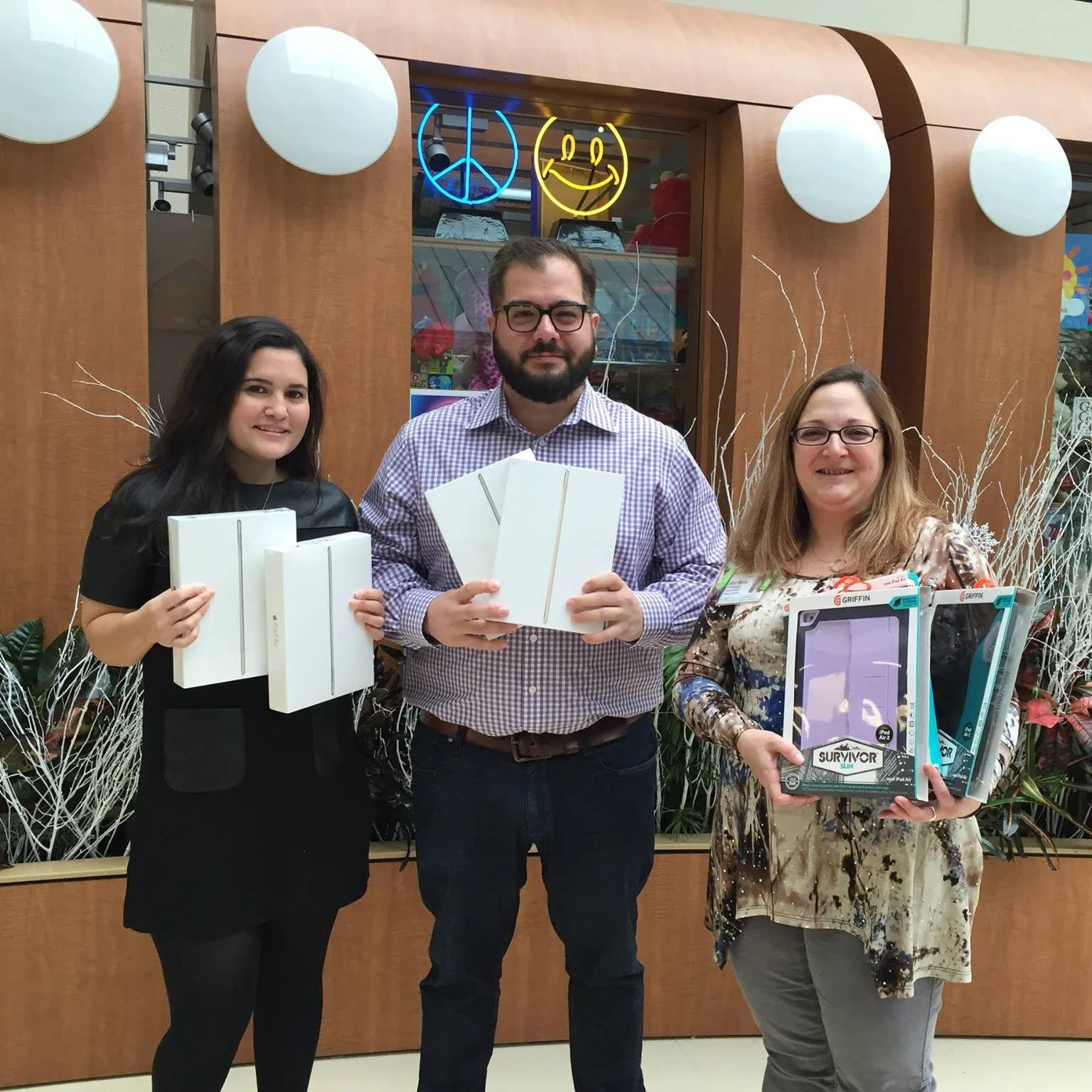The Summer Hope Foundation founder, Eddie Mouradian, and board member, Carla Alvarez Woitovich, presenting first iPad Project donations to Cohen Children's Hospital in 2015.