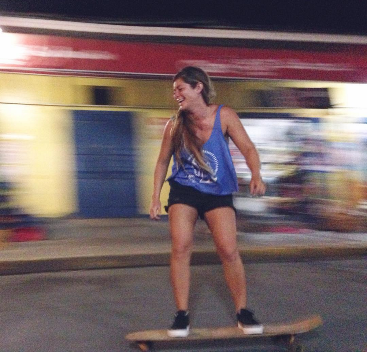 Nena Belen of TuCamino Travel skateboarding around the surf shop... SDJS has lots of fun, paved hills.