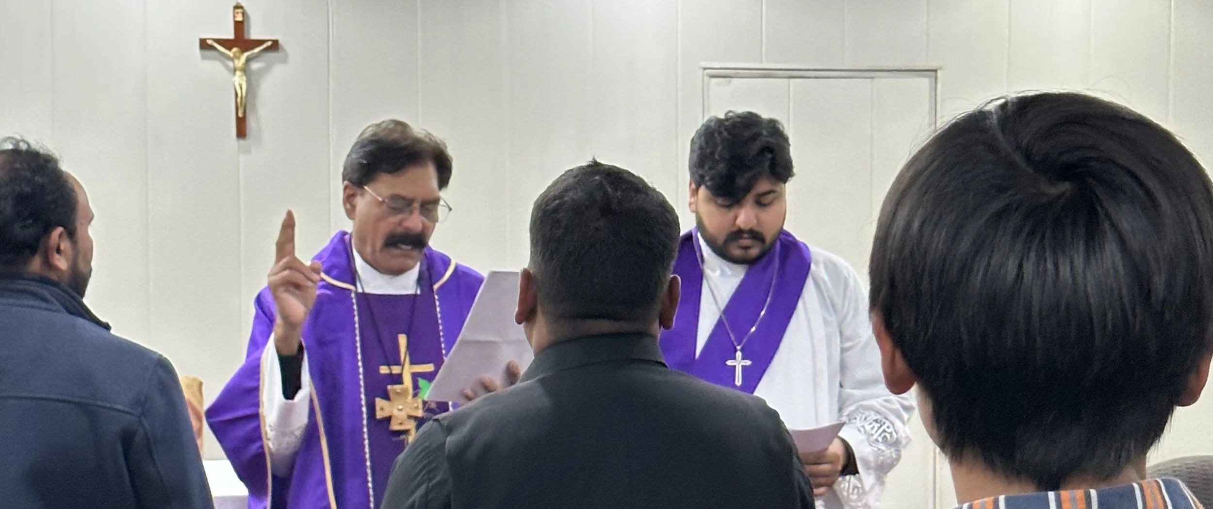 Pastor Dass blessing the LCCP congregation.jpg