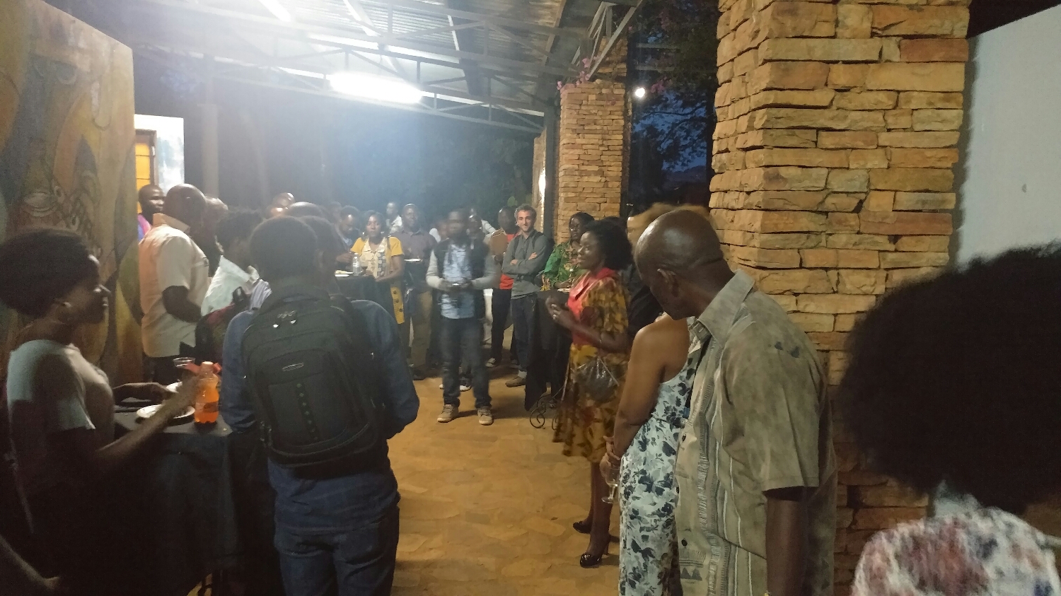 Festival Director Asiimwe Deborah Kawe addresses the crowd at the opening reception 