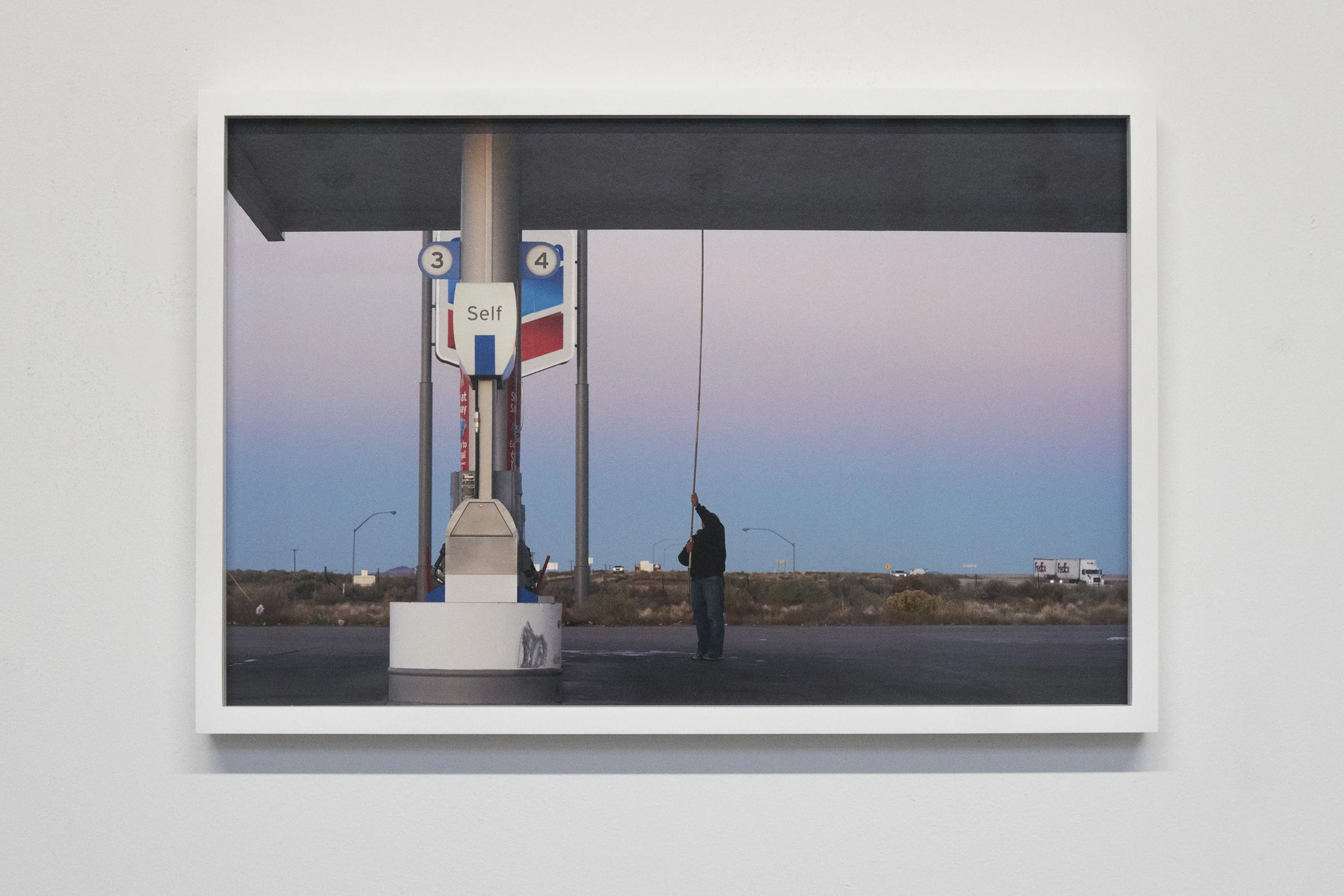 'Untitled_A Man fixing a bulb' 2016 15"x22" Archival pigment print.
