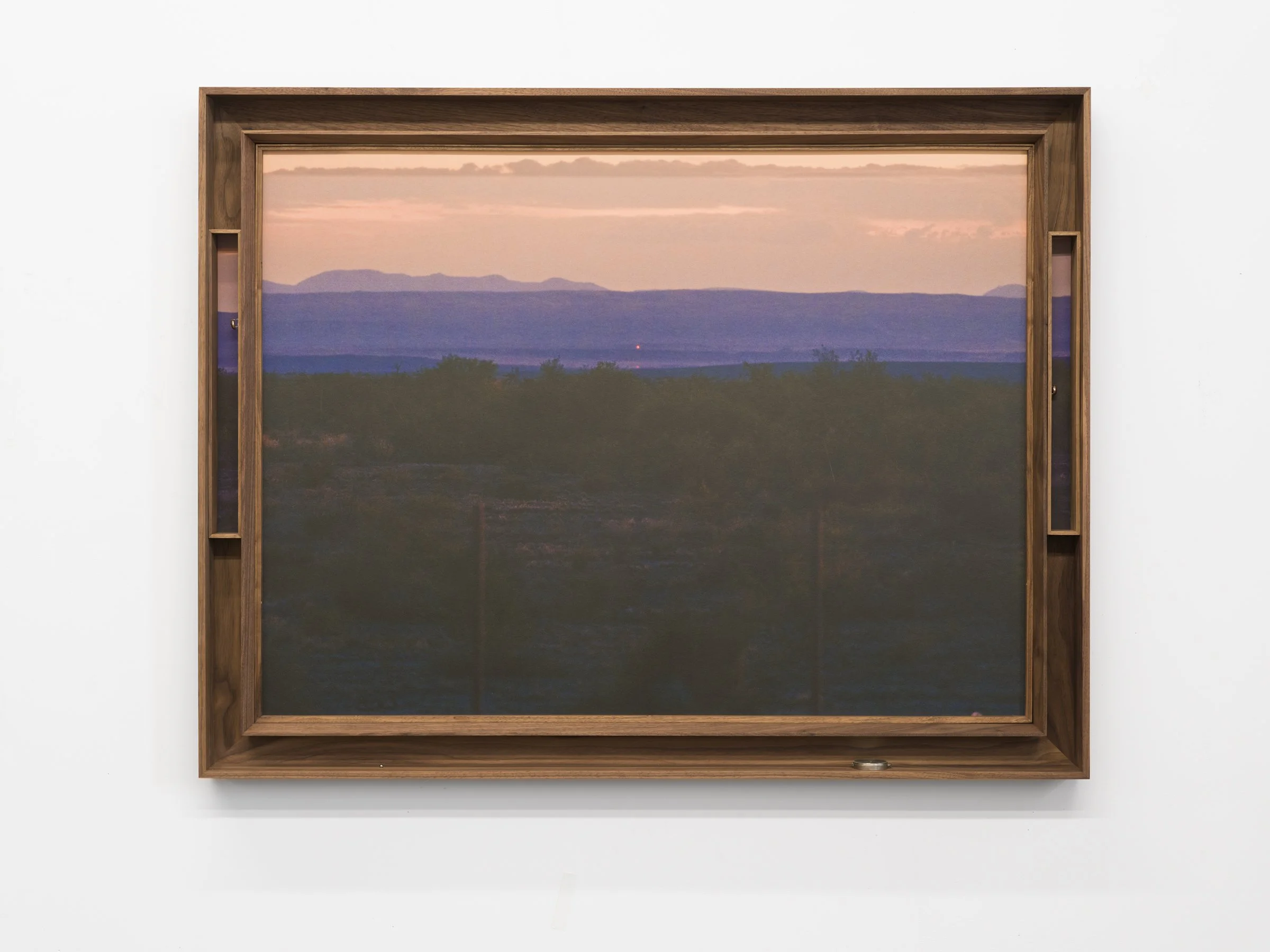 Farthest Breath – Marfa Lights, 2025, Archival pigment print mounted on Dibond, walnut double frame, found objects (steel ball, broken com-pass, brass hardware), 35 x 45 x 4 inches A distant light hovers at the edge of the frame — a signal seen,