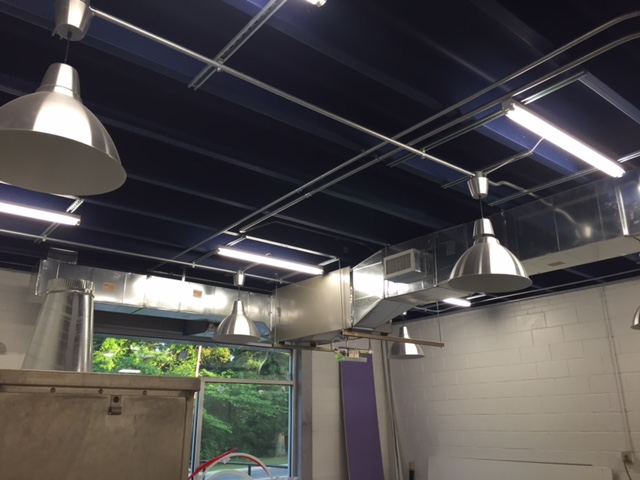 The suggestion was to bring the brand to life on the inside by using the Joe's Dough's cobalt to paint the ceilings with. It's a bold move but it sure brings this bakery to life with a twist of an industrial touch.