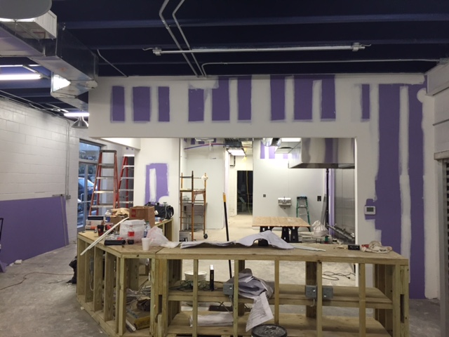The custom counter being installed, walls are prepped for paint and the equipment was being installed.