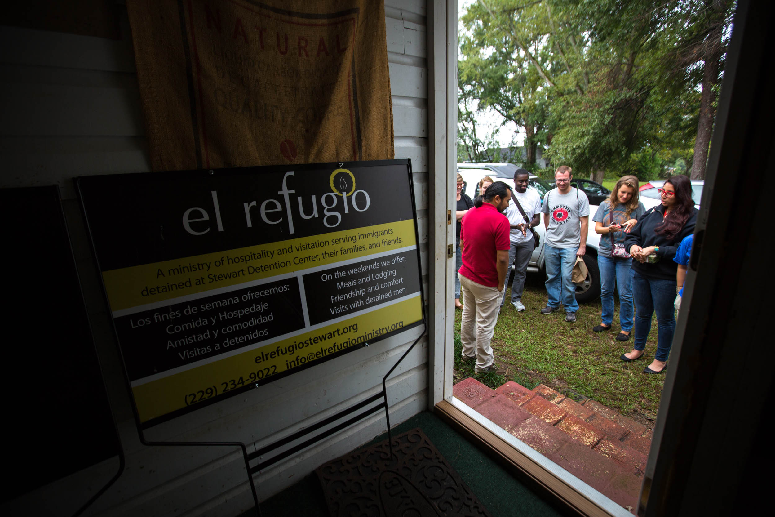 Amilcar Valencia gathers with a group of Emory University Students at El Refugio, Saturday, Sept. 12, 2015, in Lumpkin, Ga. (Photo by Branden Camp)