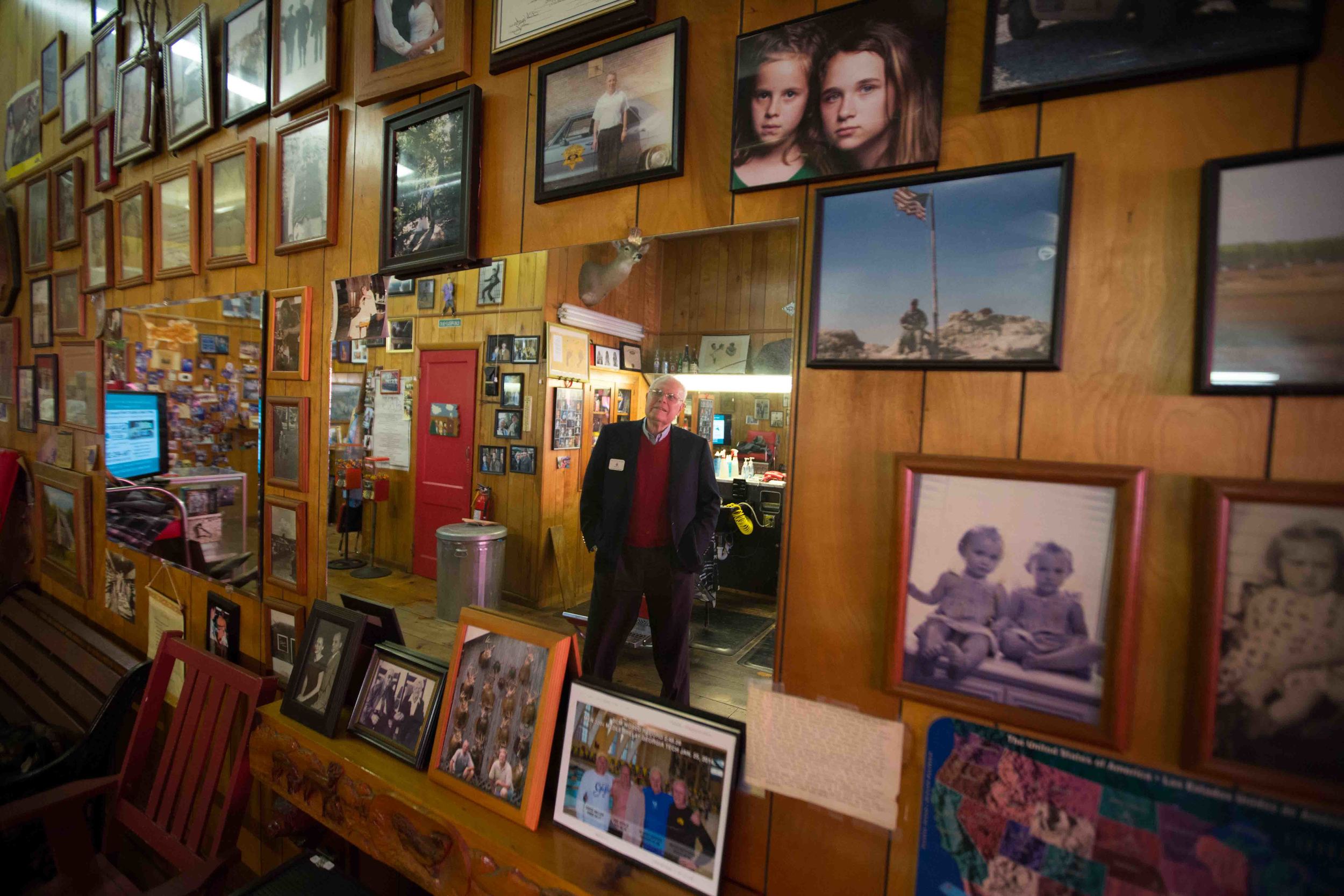 Joe McCutchen, supporter of Republican presidential candidate Ted Cruz, is reflected in a mirror while visiting City Barber Shop in downtown Ellijay, Ga., Saturday, Dec. 5, 2015. BRANDEN CAMP FOR THE BOSTON GLOBE