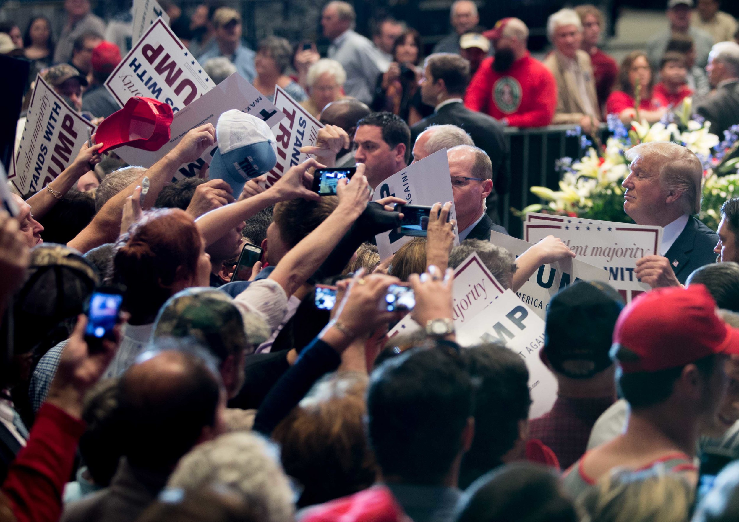 Republican presidential candidate Donald Trump signs autographs after speaking at a campaign rally, Monday, Nov. 30, 2015 at the Macon Centreplex in Macon, Ga. (AP Photo/Branden Camp)