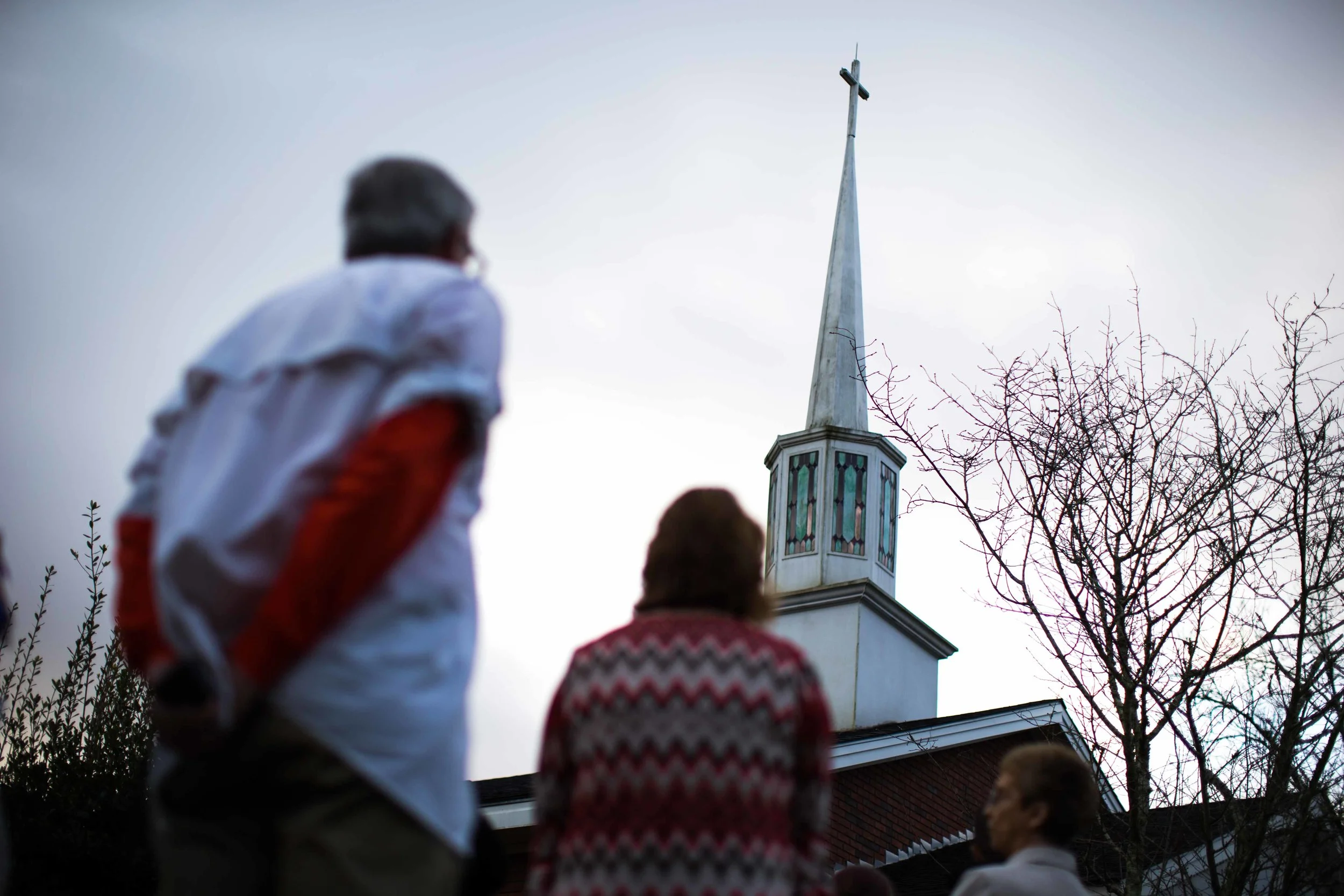 People line up to see former President Jimmy Carter teach Sunday School class at Maranatha Baptist Church in his hometown, Sunday, Dec. 13, 2015, in Plains, Ga. A recent MRI showing no cancer on Jimmy Carter's brain is "very positive" news for the former president but will not end his medical treatment, doctors said. Carter, 91, announced on Dec. 6 that doctors found no evidence of the four lesions discovered on his brain this summer and no signs of new cancer growth. (AP Photo/Branden Camp)