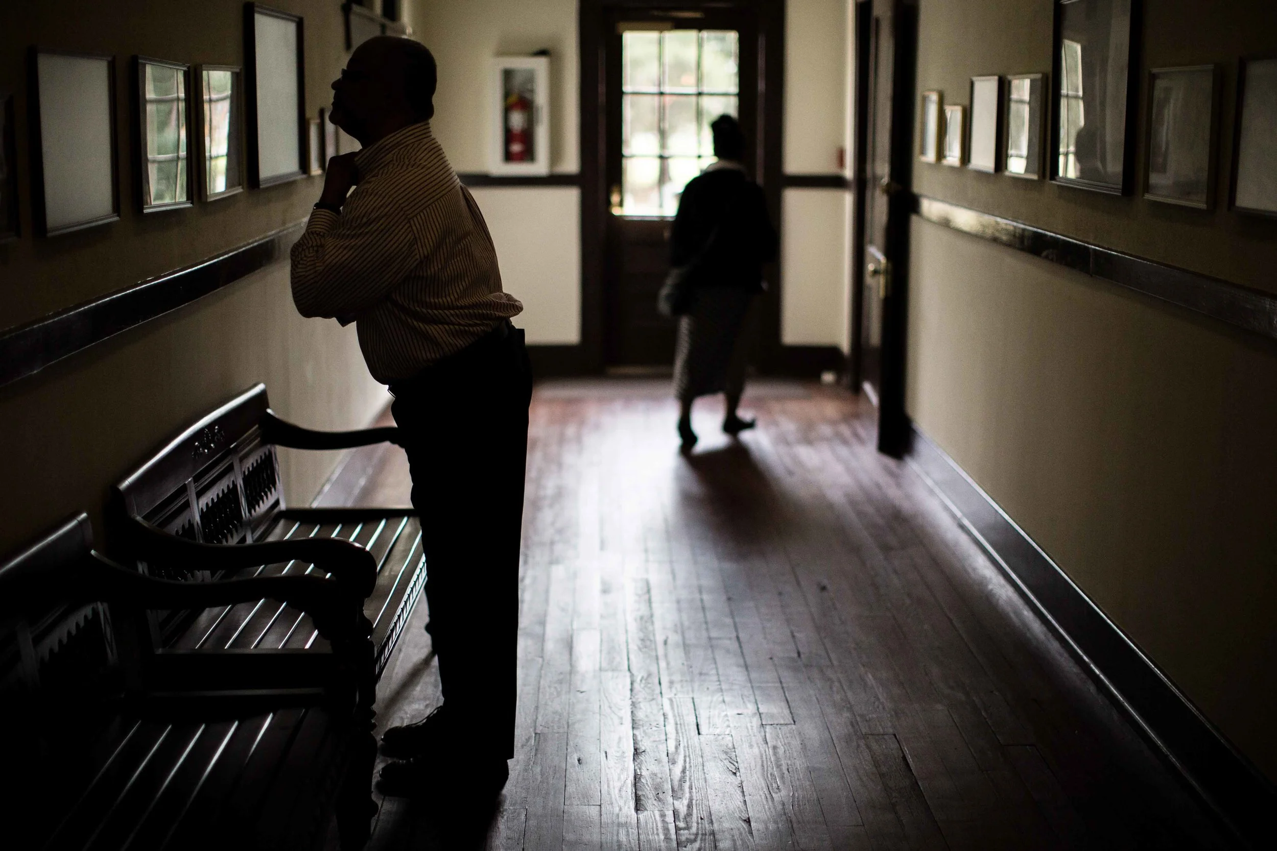 People visit the old Plains High School where former President Jimmy Carter attended, Sunday, Dec. 13, 2015, in Plains, Ga. A recent MRI showing no cancer on Jimmy Carter's brain is "very positive" news for the former president but will not end his medical treatment, doctors said. Carter, 91, announced Dec. 6 that doctors found no evidence of the four lesions discovered on his brain this summer and no signs of new cancer growth. (AP Photo/Branden Camp)