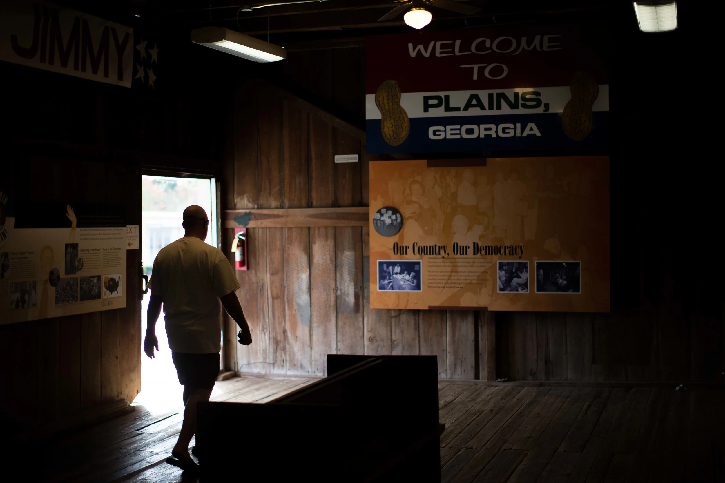 A man walks through former President Jimmy Carters' campaign headquarters in downtown Plains, Ga., Sunday, Dec. 13, 2015. A recent MRI showing no cancer on Jimmy Carter's brain is "very positive" news for the former president but will not end his medical treatment, doctors said. Carter, 91, announced Dec. 6 that doctors found no evidence of the four lesions discovered on his brain this summer and no signs of new cancer growth. (AP Photo/Branden Camp)