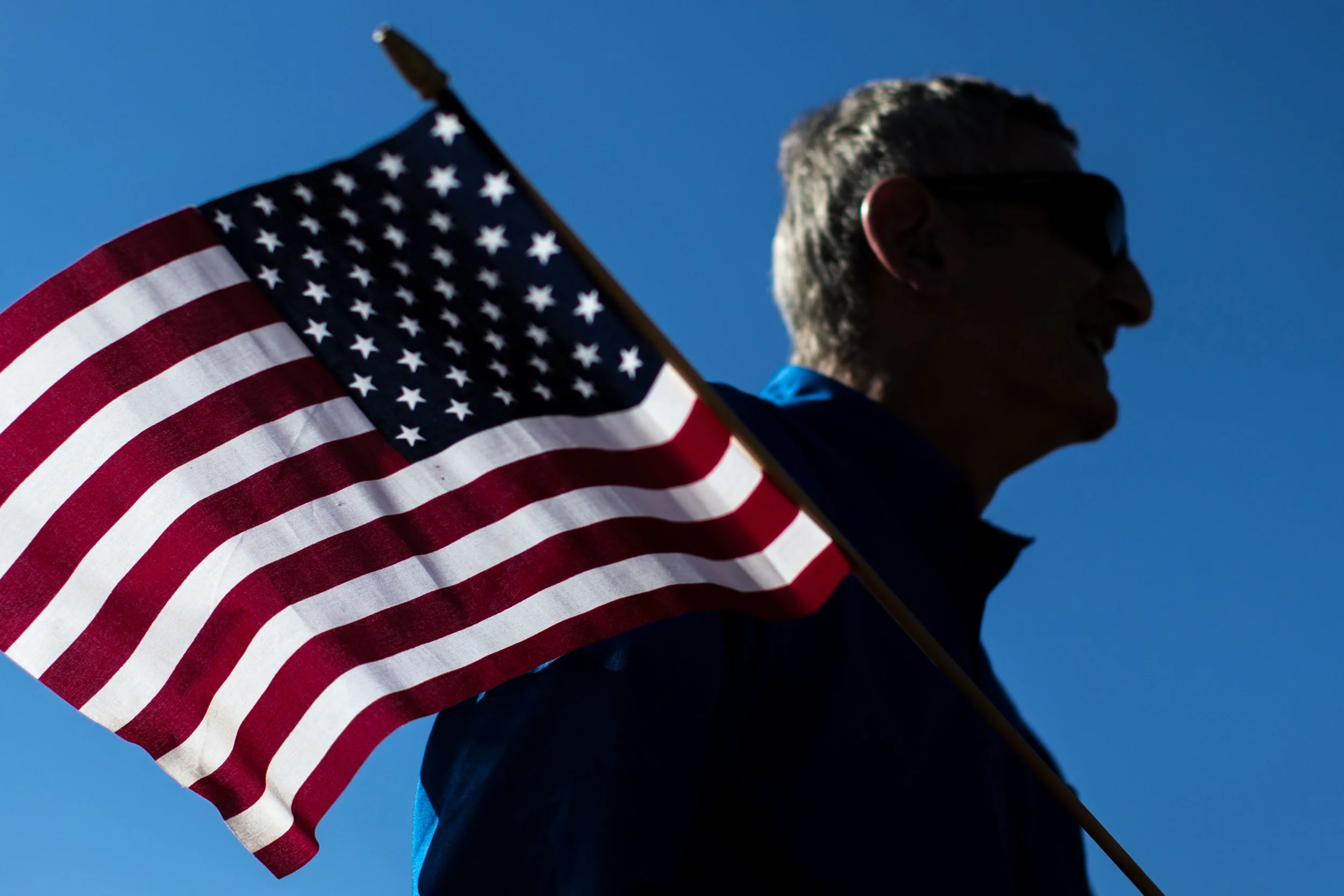Nov. 11, 2015 - Marietta, Ga, U.S - GEORGE ESSAFF holds a flag during a Veterans Day parade. (Credit Image: © Branden Camp via ZUMA Wire)