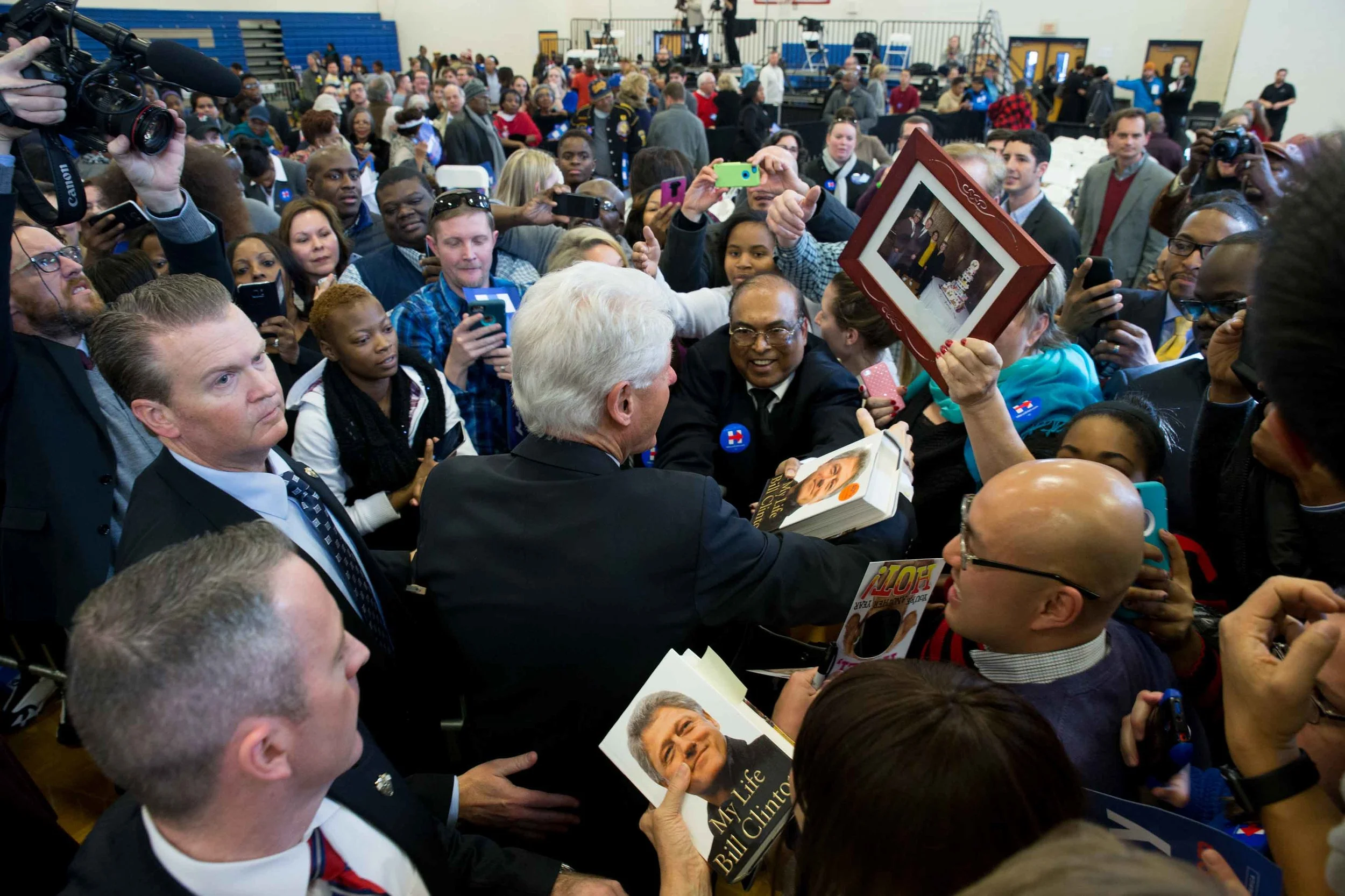 Former President Bill Clinton greets attendees during a campaign stop for his wife, Democratic presidential candidate Hillary Clinton, at North Clayton High School. Branden Camp/ZUMA wire