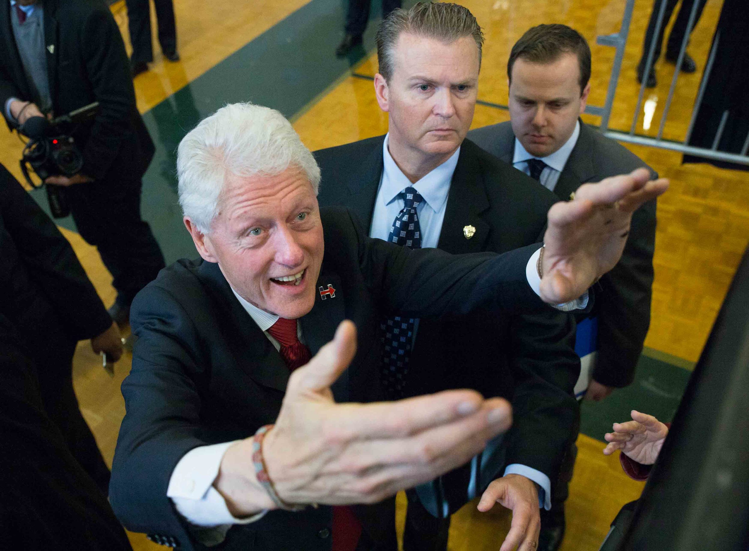 Former President Bill Clinton greets attendees during a campaign stop for his wife, Democratic presidential candidate Hillary Clinton, at North Clayton High School. Branden Camp/ZUMA wire