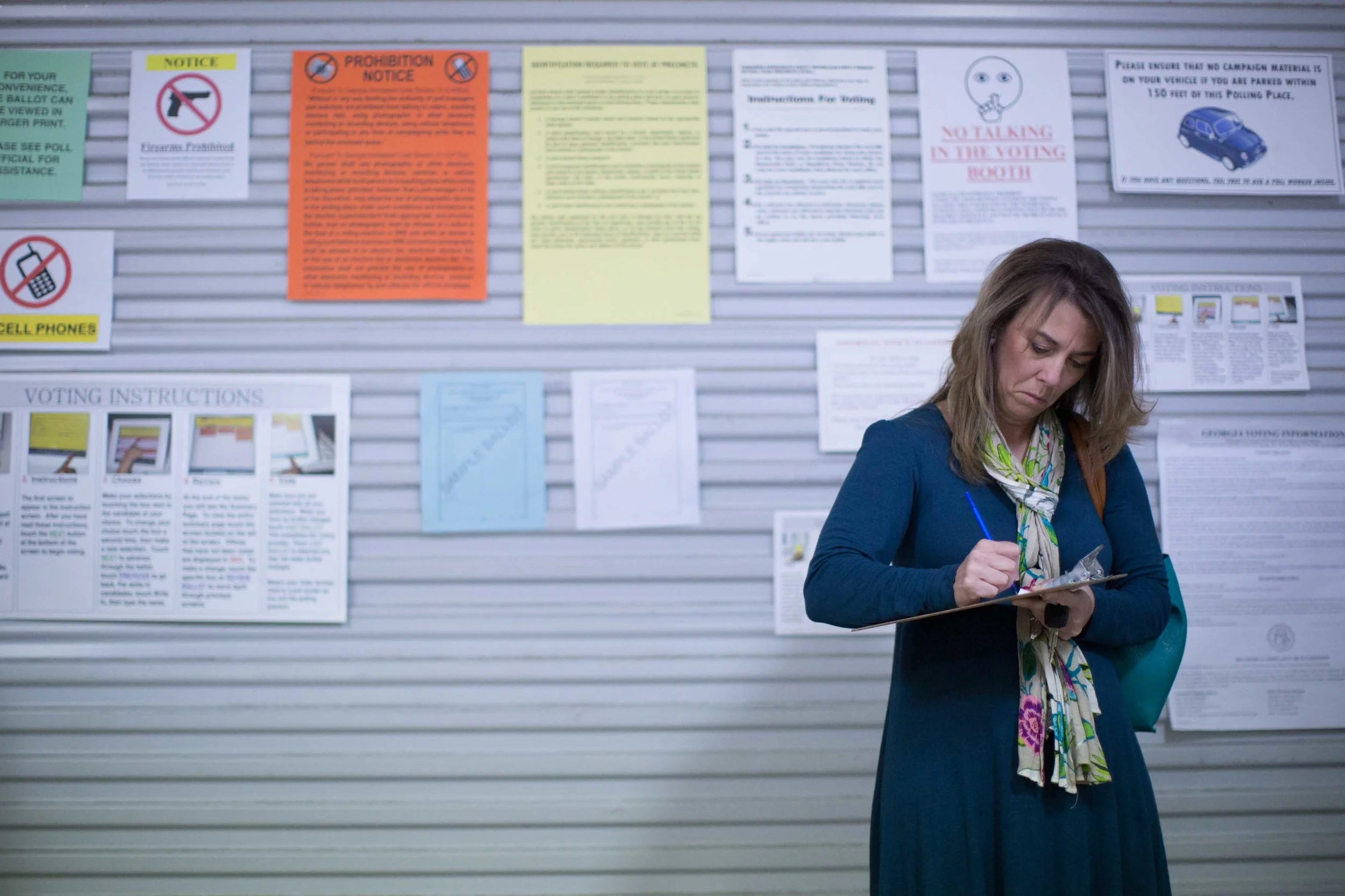 TAYLORSVILLE, GA - MARCH 1, 2016: A Georgia voter fills out voting paper work before casting her ballot at a fire station on Super Tuesday March 1, 2016, in Taylorsville, Georgia. Voters head to the polls to cast their votes on Georgia's presidential primary. (Photo by Branden Camp/Getty Images)