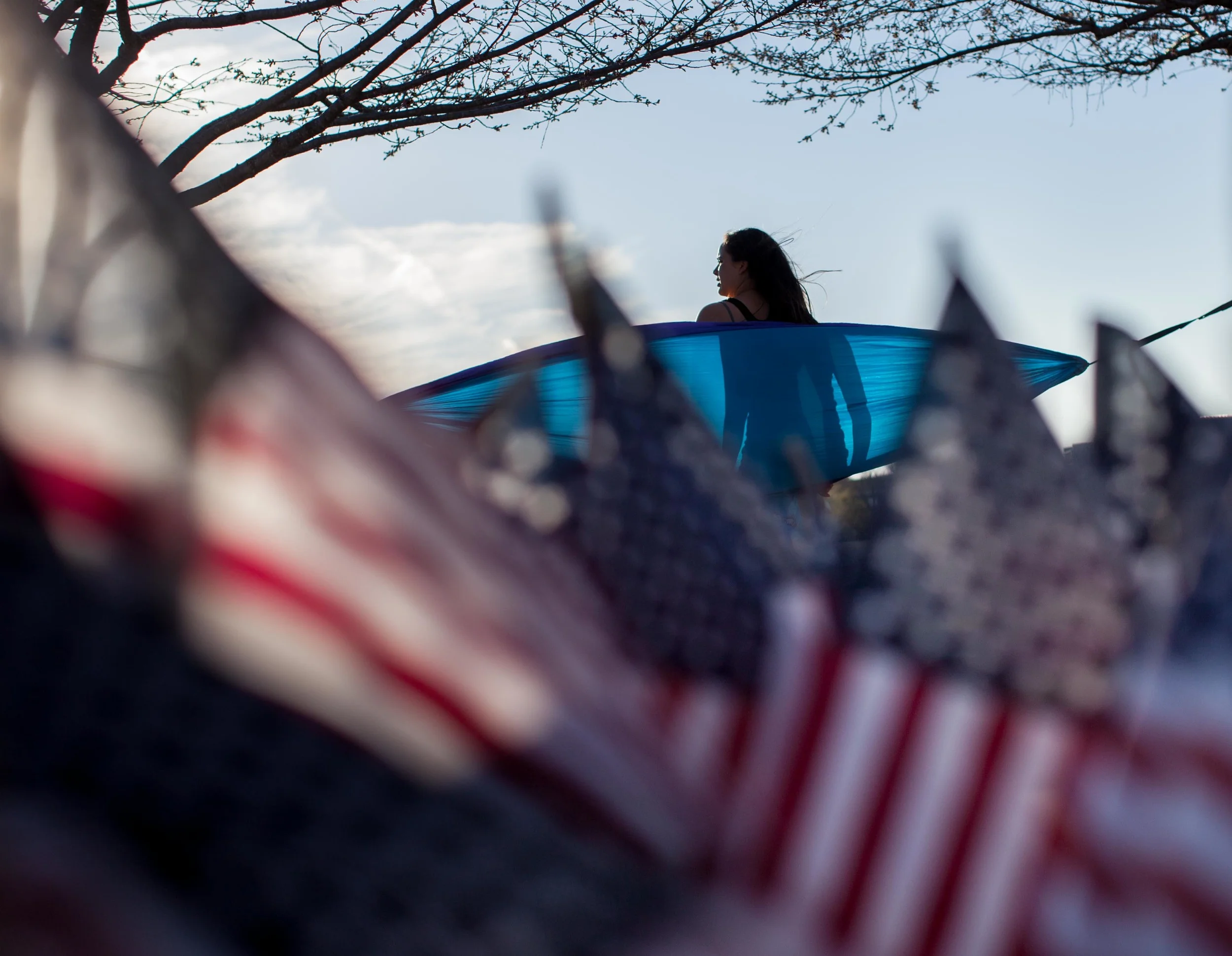 A student relaxes in a hammock on campus at Kennesaw State University, Tuesday, March, 15, 2016, in Kennesaw, Ga. Photo by Branden Camp