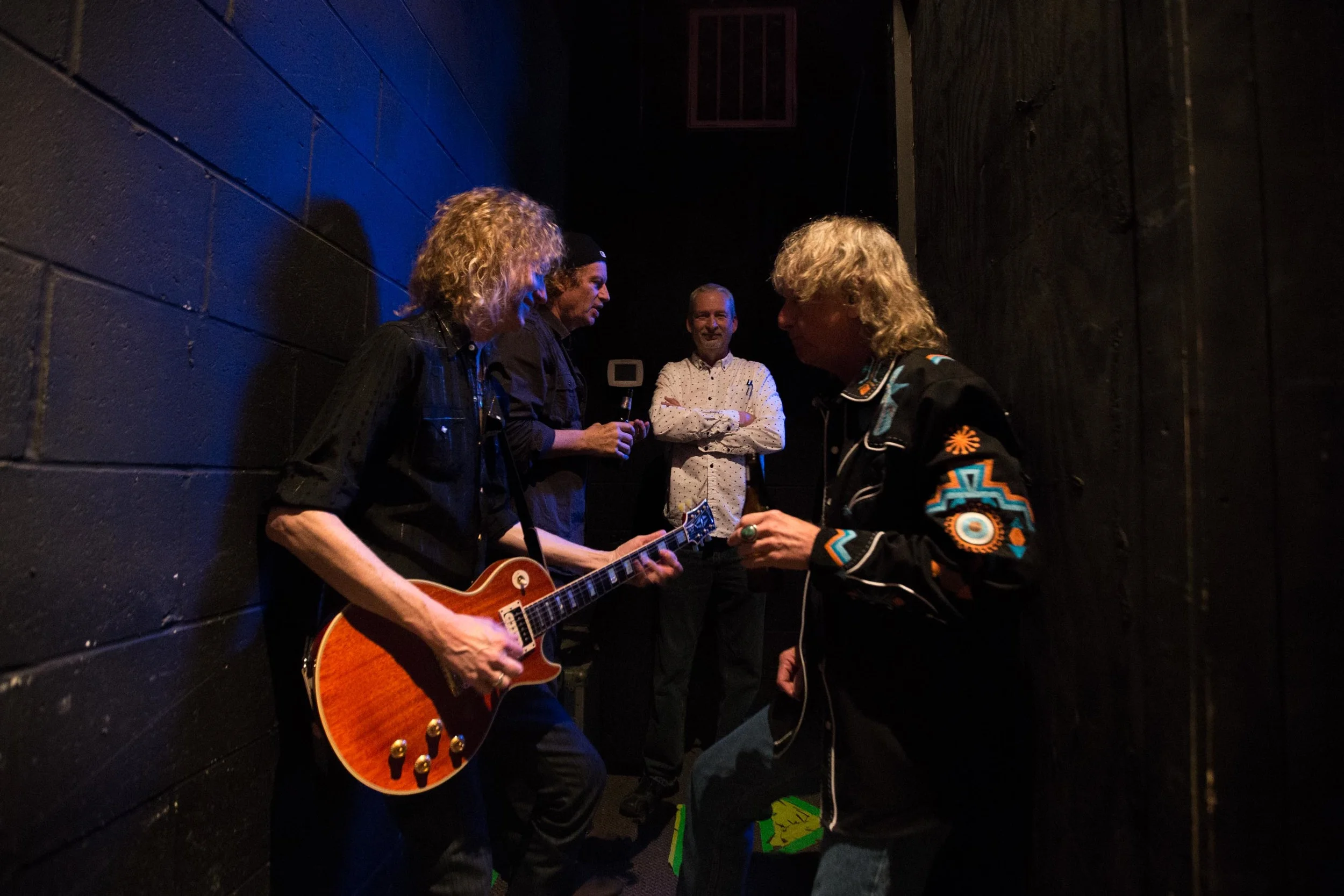 (L-R) Guitarist Peter Stroud, Jimmy Hall, of Wet Wille, Charles Camp, documentary producer, and Stillwater keyboardist Eddie Long wait backstage during a Stillwater reunion show in Macon, Ga.