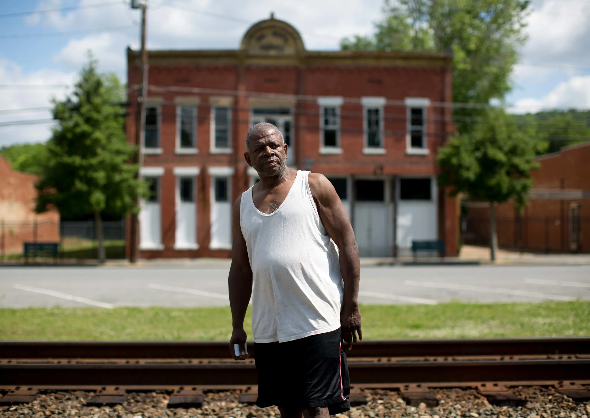 Kingston, Georgia resident Ronald Lee poses for a photo in downtown Kingston, Friday, May 13, 2016. Kingston, like many small American towns, are becoming vacant. Lee says that due to extremely low water pressure, businesses don't have sufficient water pressure to operate their businesses. Photo by Branden Camp