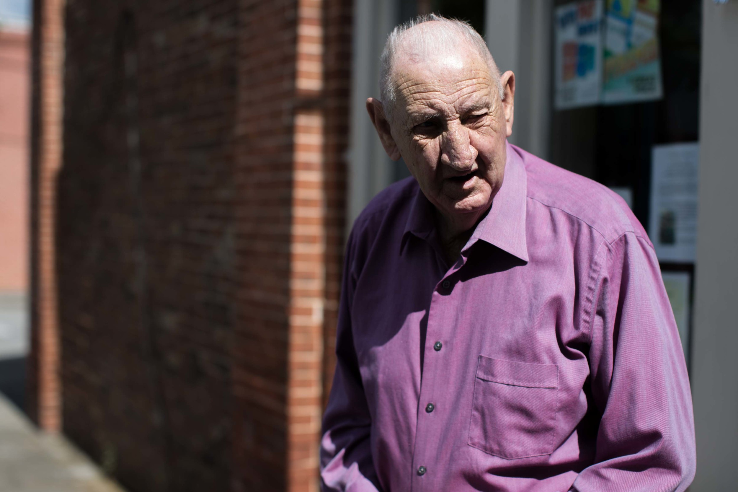  86-year-old G.B. Hood, who has lived in Kingston his whole life, exits a local convenience store in downtown Kingston, Ga. 