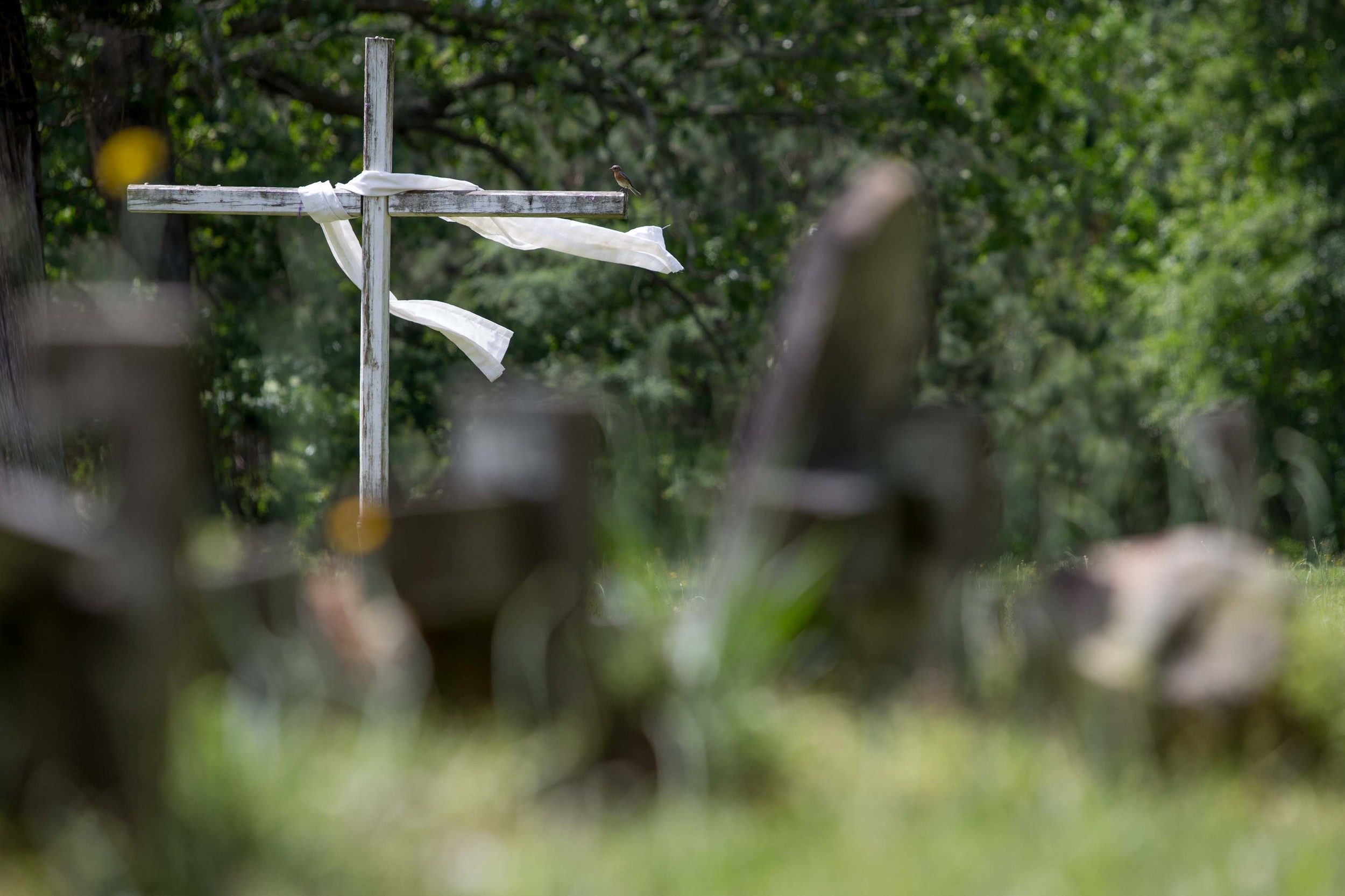  A cross sits on display inside a cemetery in Kingston, Ga.   