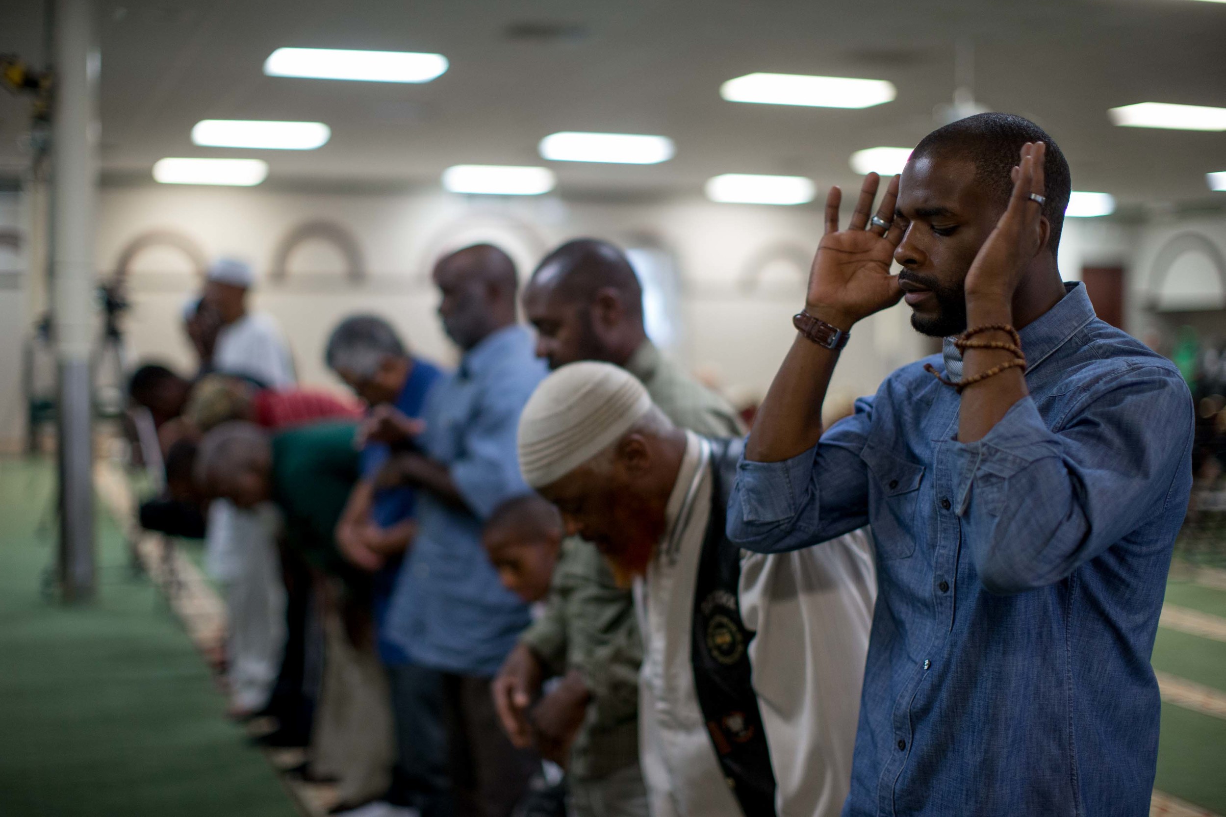 June 9, 2016 - Atlanta, Ga, U.S - Muslim men pray before an interfaith service at the Atlanta Masjid of Al Islam mosque in Atlanta. People gathered to honor the late Muhammad Ali, who died on June, 3, 2016, in Phoenix, Arizona.
