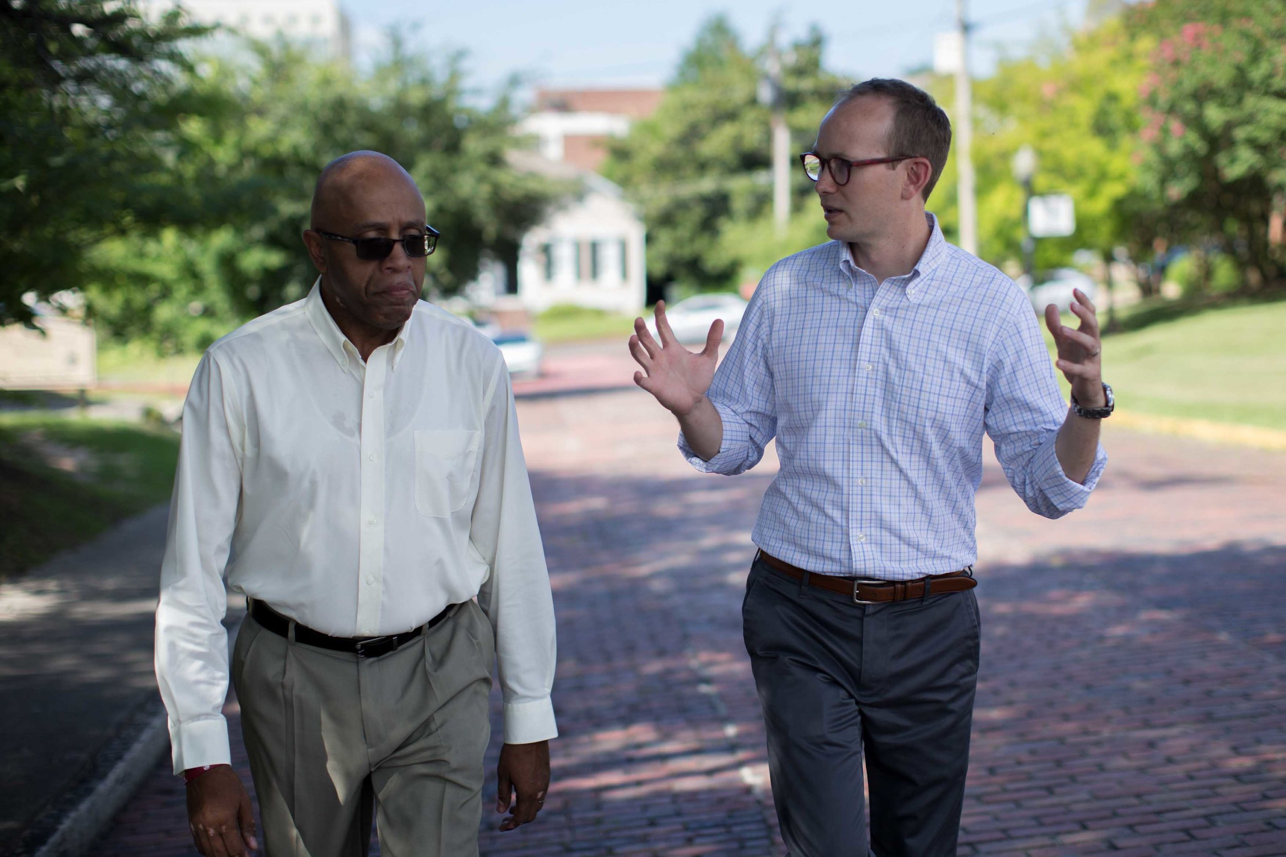 The Rev. James W. Goolsby, Jr., pastor of the First Baptist Church, left, and the Rev. Scott Dickison, pastor of the First Baptist Church of Christ, walk together in Macon, Ga., on Monday, July 11, 2016. In September 2016, they plan to lead joint discussions with their churches' members on racism in the history of the U.S., and also in the history of their congregations. (AP Photo/Branden Camp)