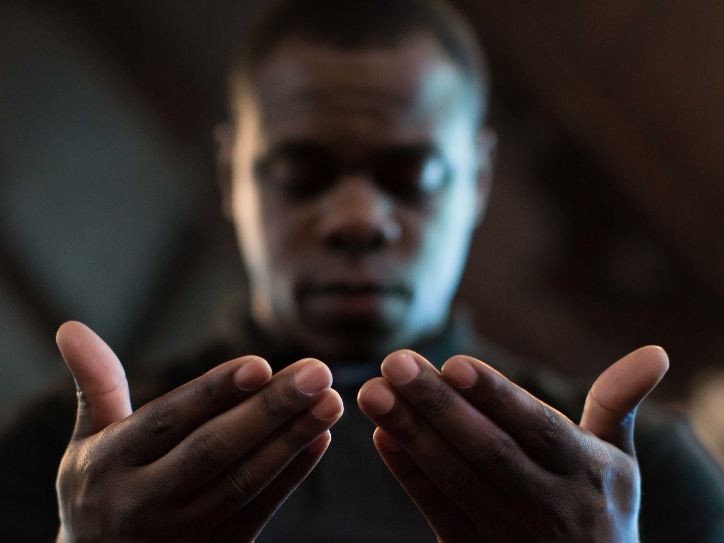 Paul Bronson prays during a Black Lives Matter prayer vigil at First Baptist Church, a predominantly African-American congregation, in Macon, Ga., on Monday, July 11, 2016. The pastors of both First Baptist Churches in Macon are trying to bridge the stubborn divide of race against a painful and tumultuous backdrop. (AP Photo/Branden Camp)