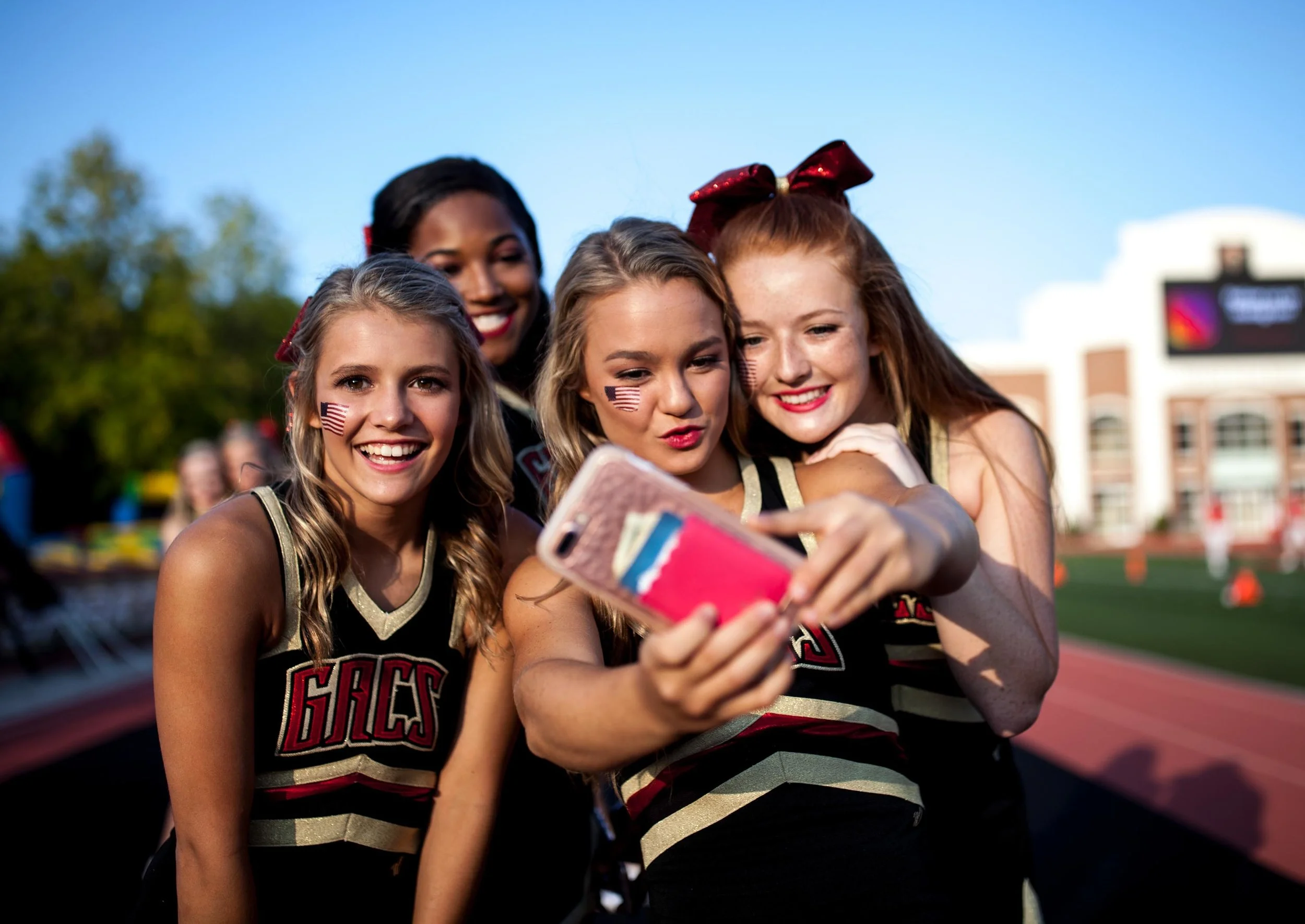 Greater Atlanta Christian cheerleaders pose for a photo before a high school football game against Valor Christian of Colorado, Friday, Sept. 8, 2017, in Norcross, Ga. Branden Camp for The AJC