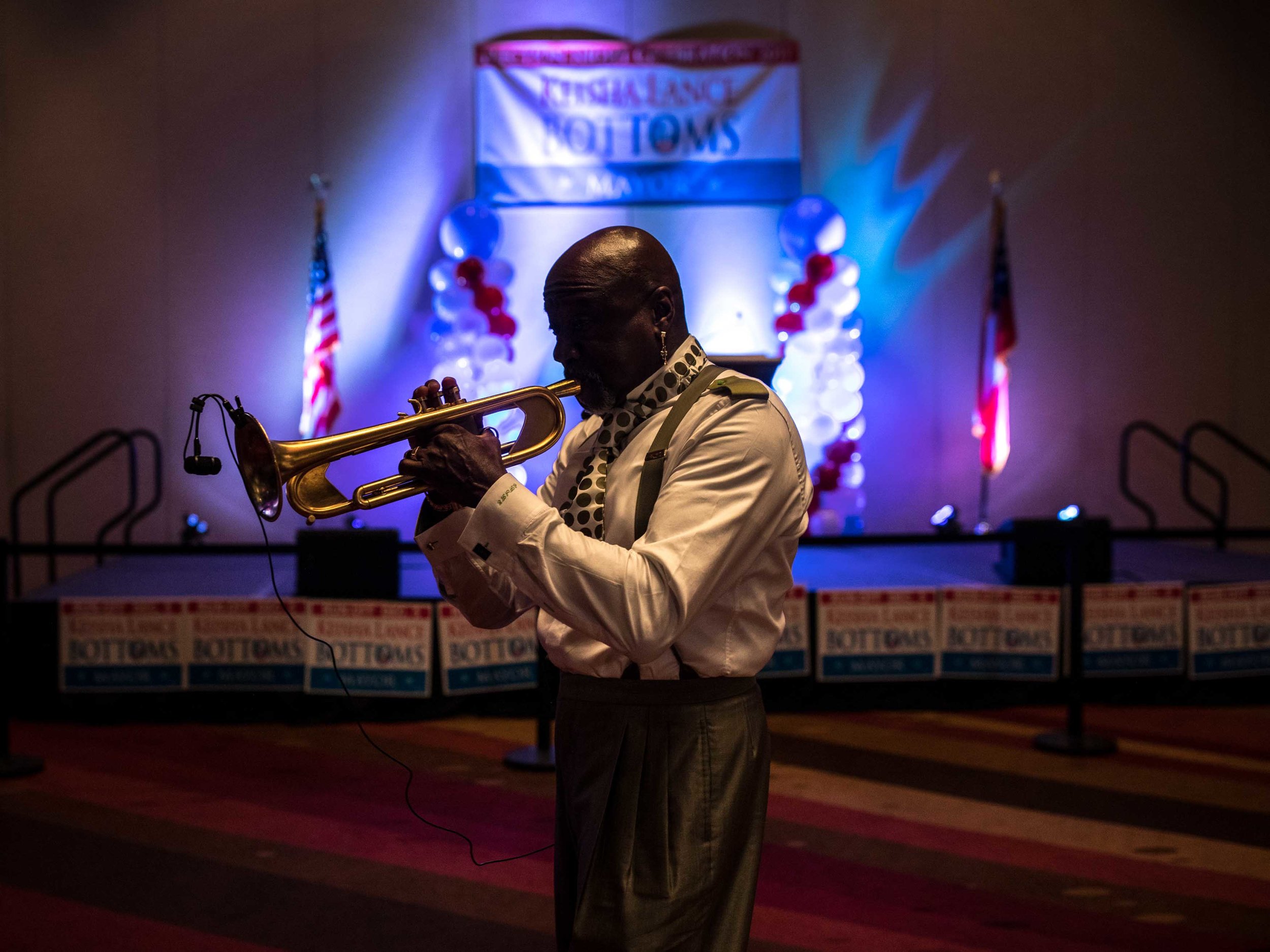 A trumpet player warms up during sound check for an election party for Keisha Lance Bottoms.