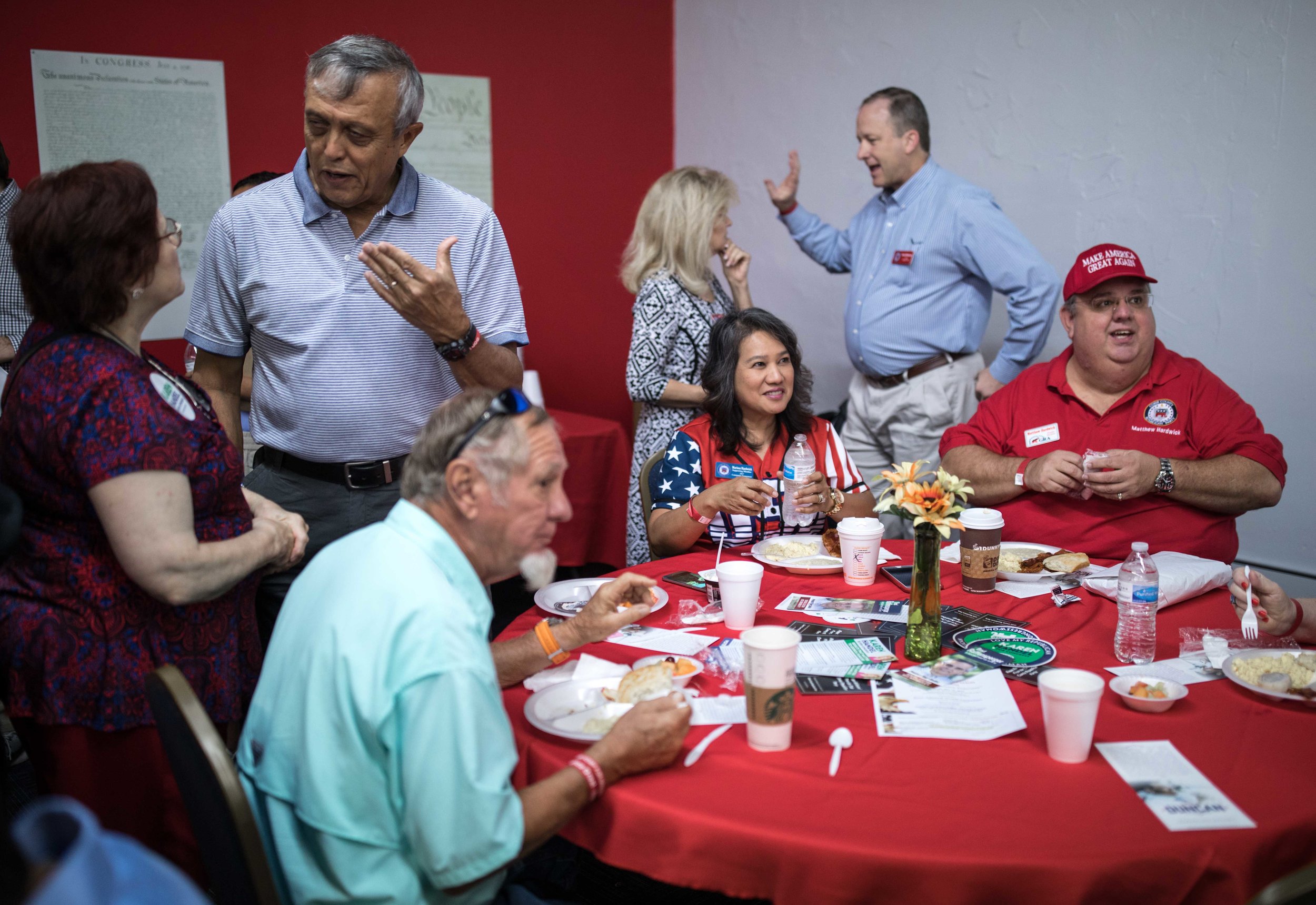 Cobb County Commission Chairman Mike Boyce, left, talks with a woman during a breakfast meet and greet at the Cobb County GOP headquarters, Saturday, Oct.6, 2018, in Marietta, Ga.