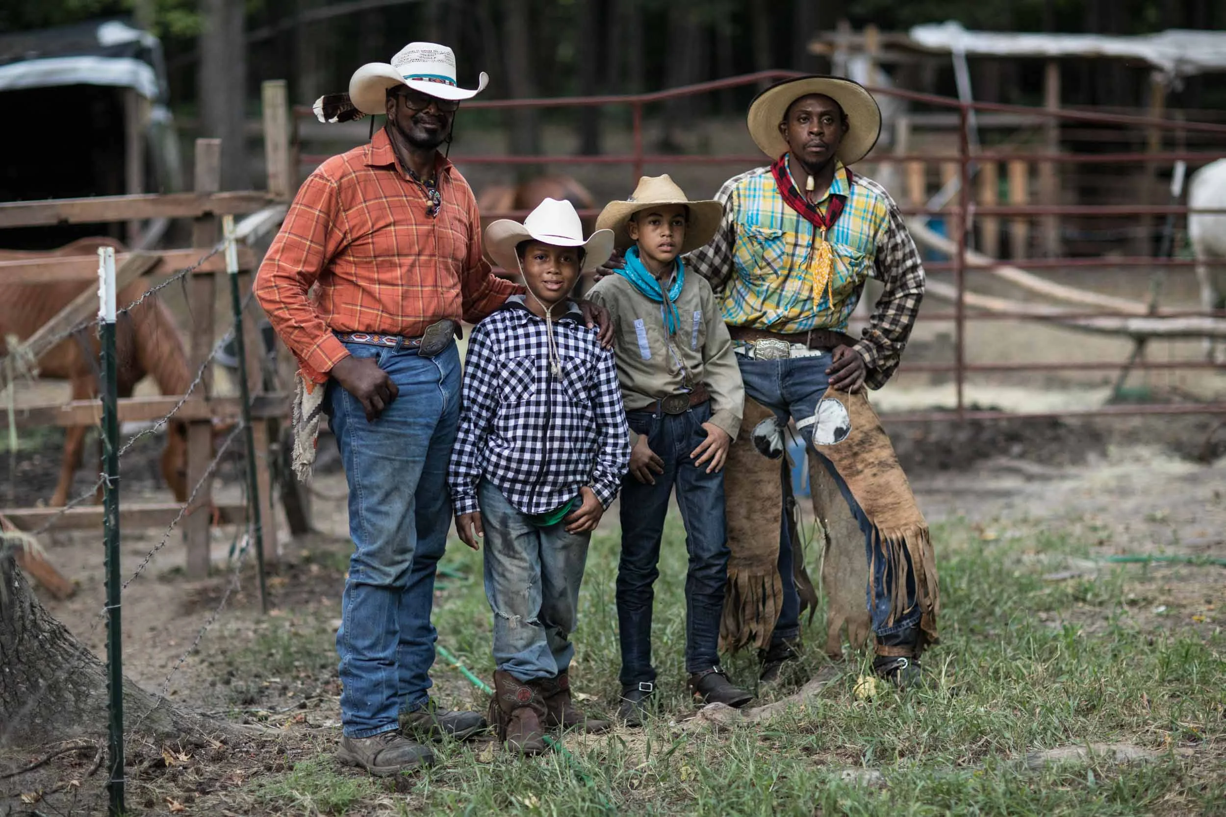 Billy Ray Thunder, Justin Brown, 11, Logan Dansby, 12, and Arkansas Dave pose for a portrait on a ranch off of Flat Shoals Parkway, Tuesday, July 30, 2019, in Union City, Ga. Branden Camp for AJC