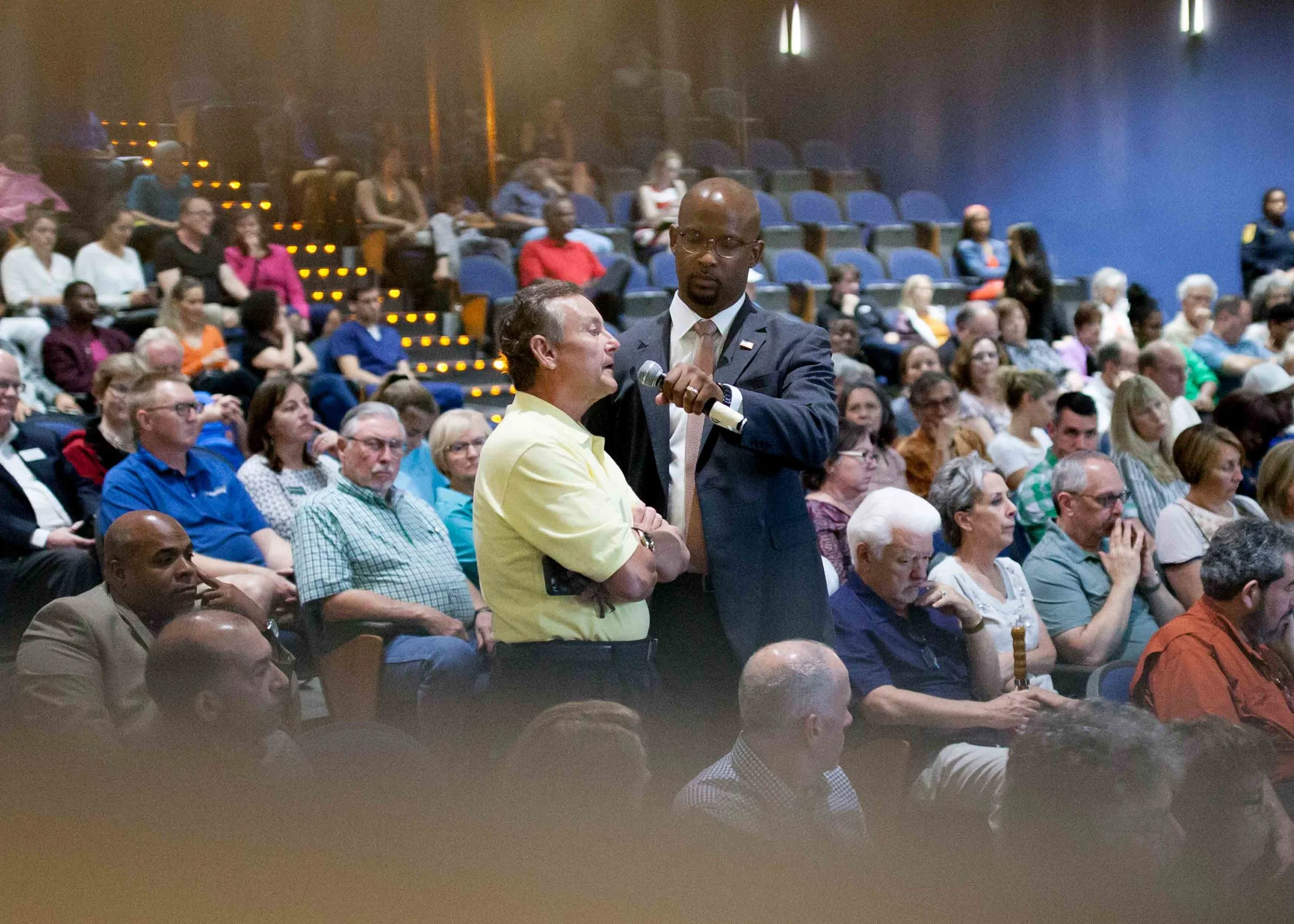 A man asks Rep. Lucy McBath, D-Ga., a question during a town hall at Dunwoody High School on Saturday, June 8, 2019 in Dunwoody, Ga. Branden Camp for AJC