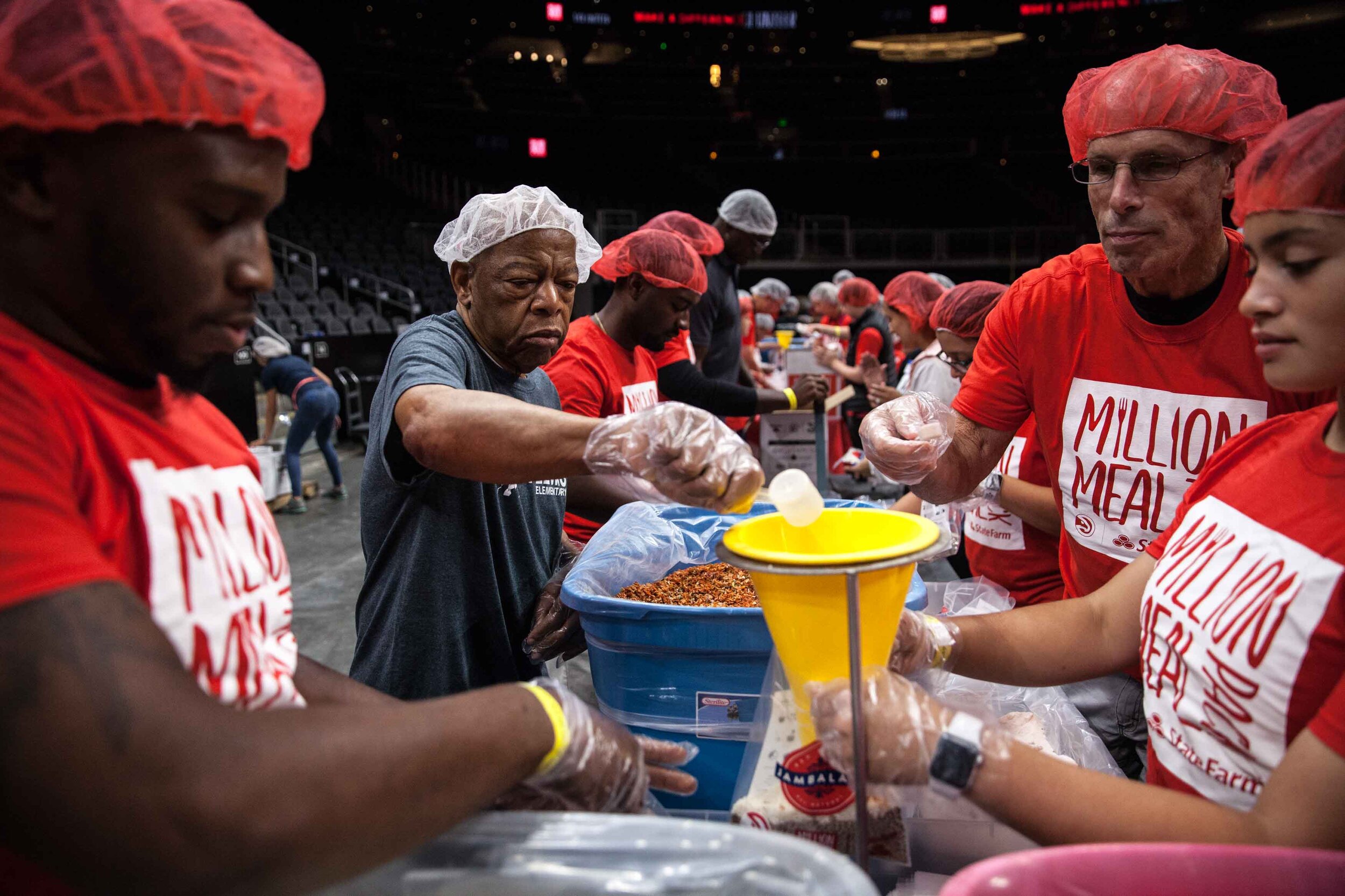 U.S. Rep. John Lewis helps volunteers pack meals, Saturday, Oct. 5, 2019, in Atlanta. Branden Camp for AJC