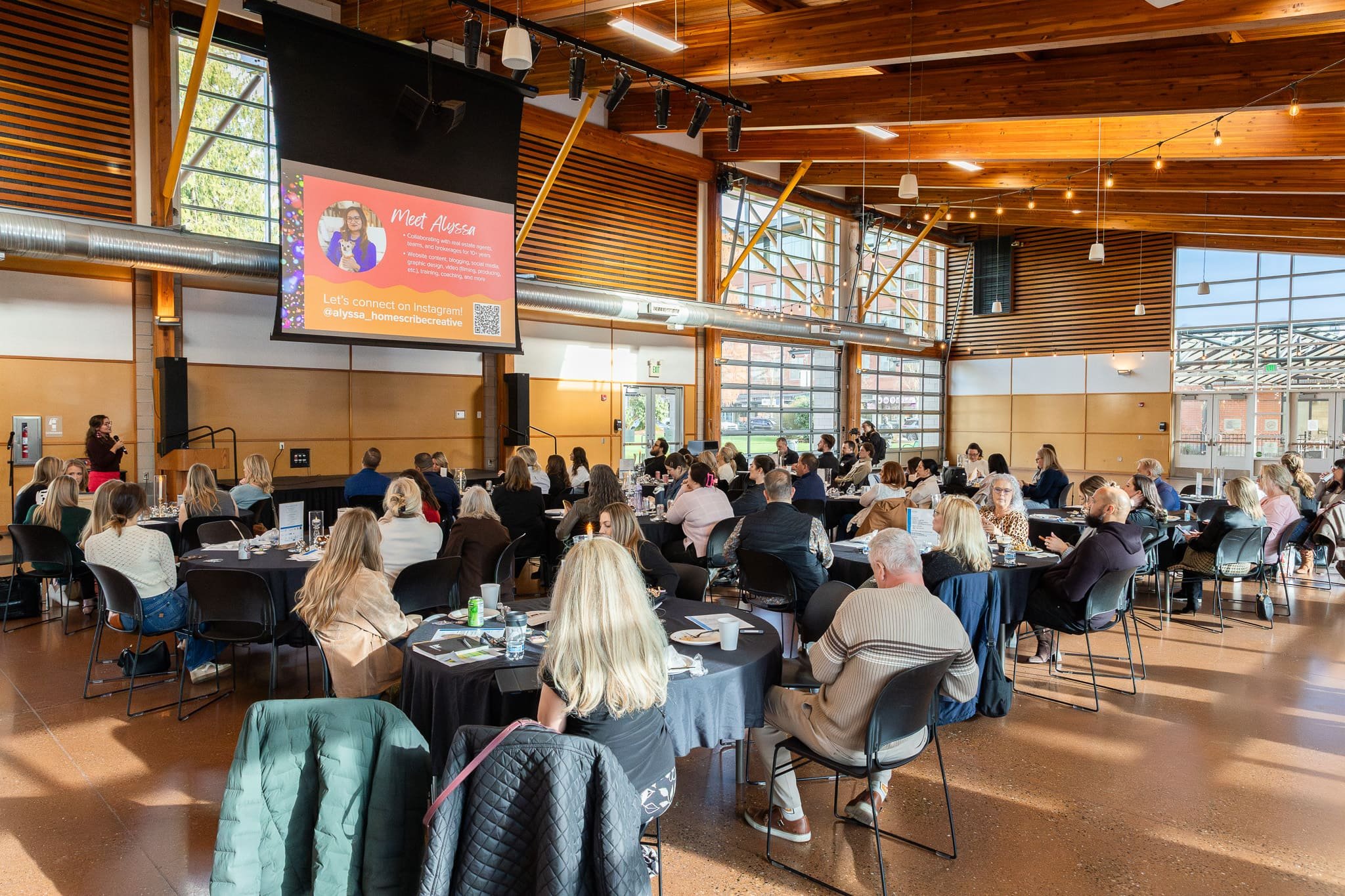 Attendees seated at tables during the WCR Tacoma-Pierce County kickoff presentation