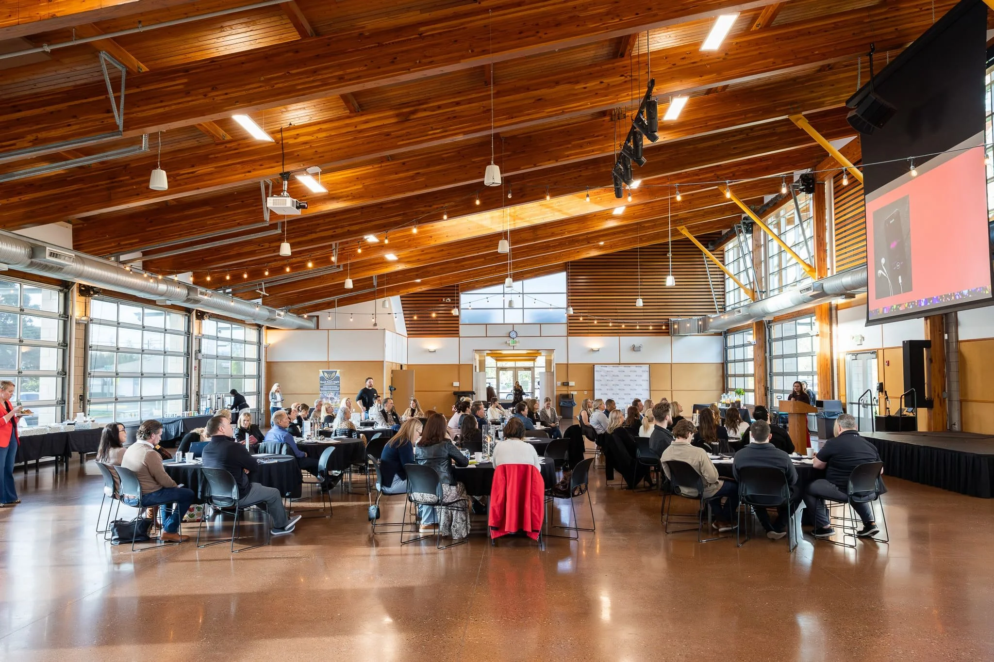 Attendees seated at tables during the WCR Tacoma-Pierce County kickoff presentation