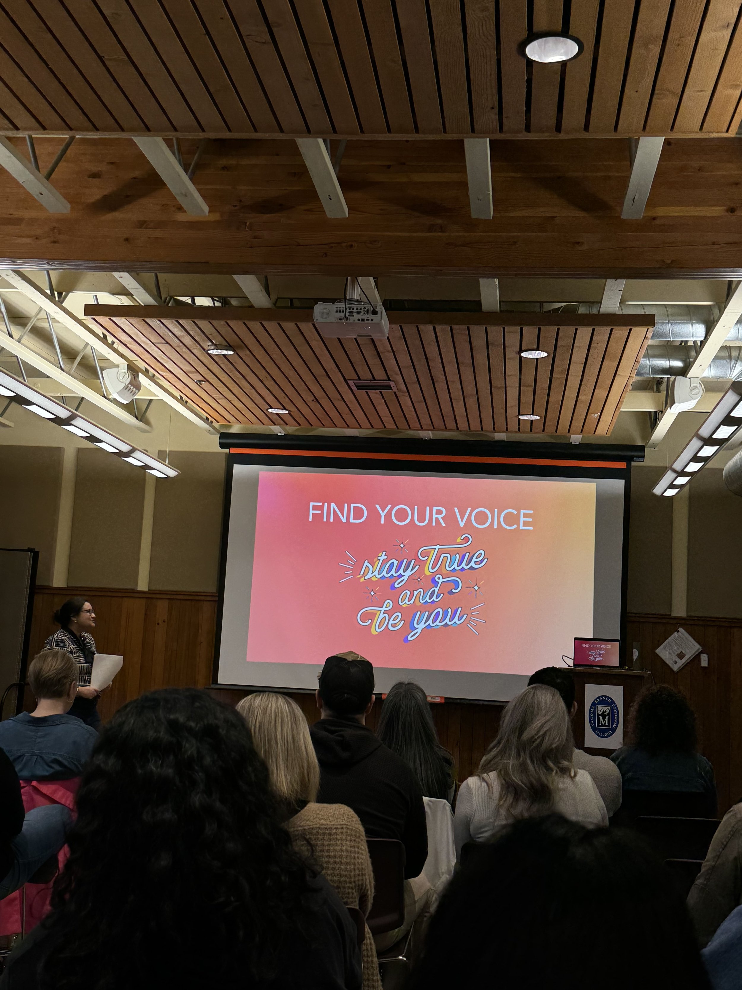 Alyssa Christensen presenting Find Your Voice, Stay True and Be You during a real estate marketing training.