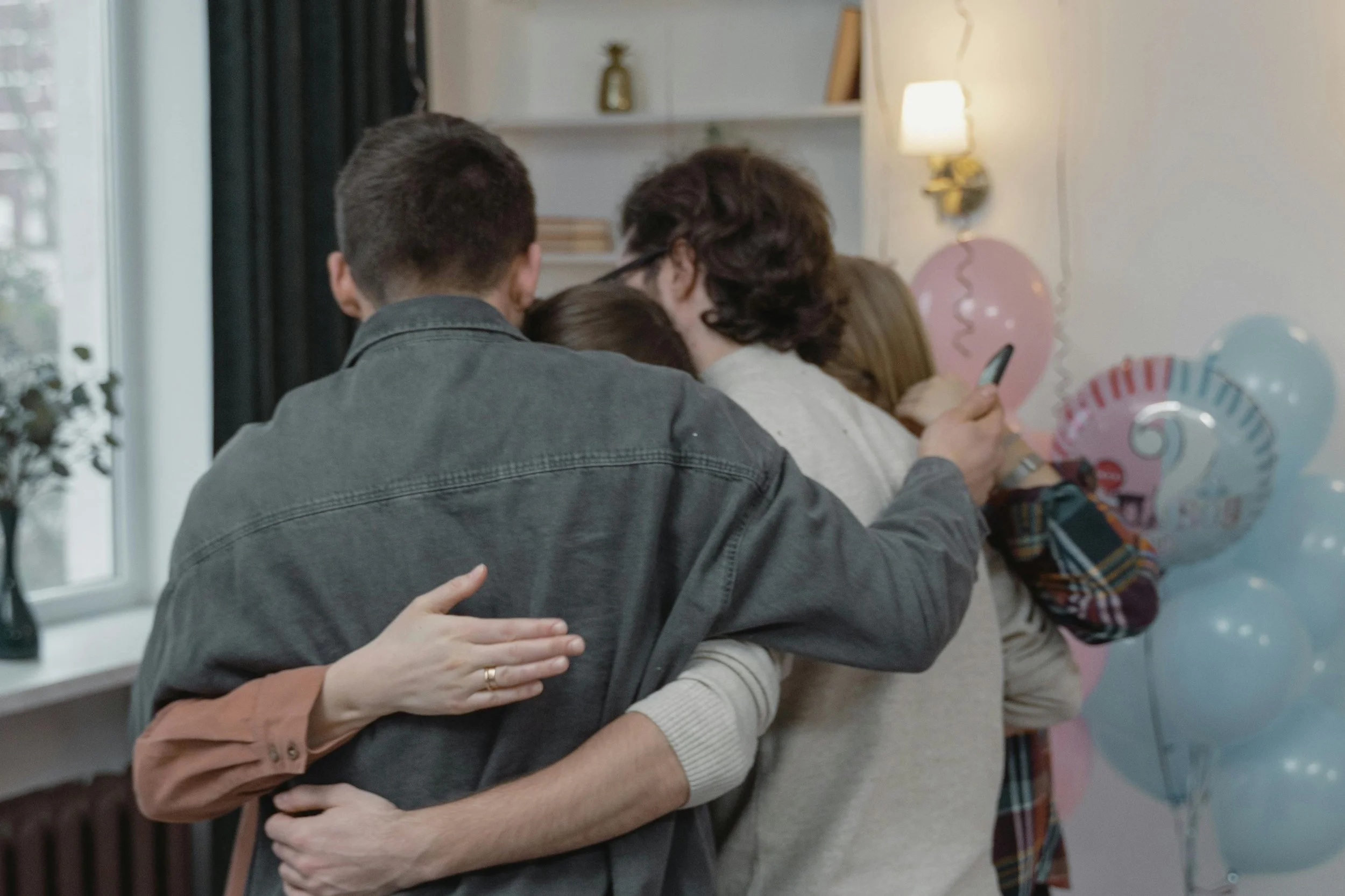 Friends hugging and providing emotional support