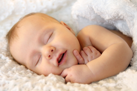 beautiful-baby-smiling-asleep