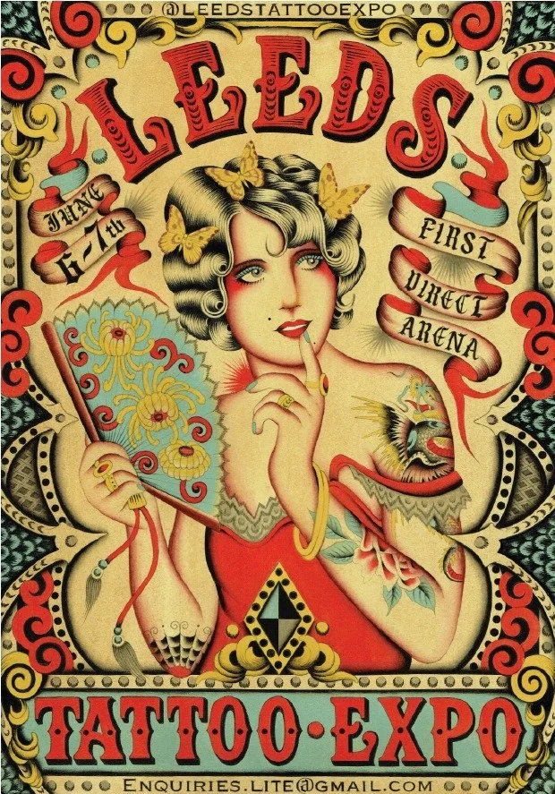 Vintage-style poster advertising the Leeds Tattoo Expo featuring a tattooed woman with butterflies, floral designs, and intricate tattoos, with decorative borders and banners.