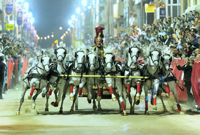 The thunderous horses at seven-a-breast electrify the spectators...