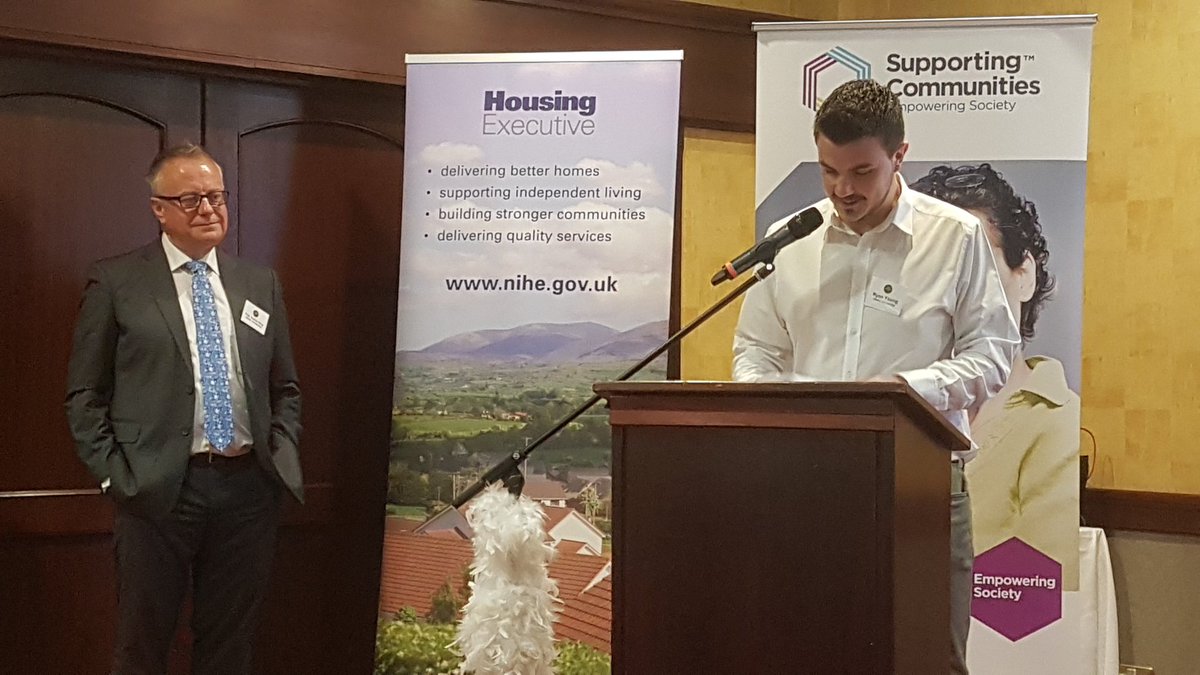 Ryan Young opens the conference on behalf of the current Housing Management students as Prof. Paddy Gray looks on.